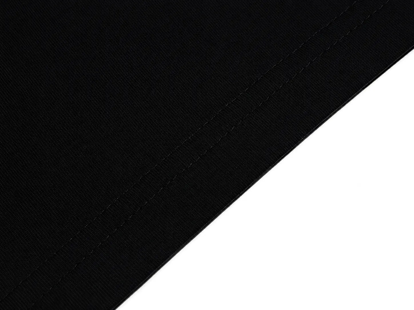 Close-up of a black fabric surface with a diagonal white background area showing the material texture and stitching. TCH Rhinestone Floral Wing Techno Graphic T-Shirt