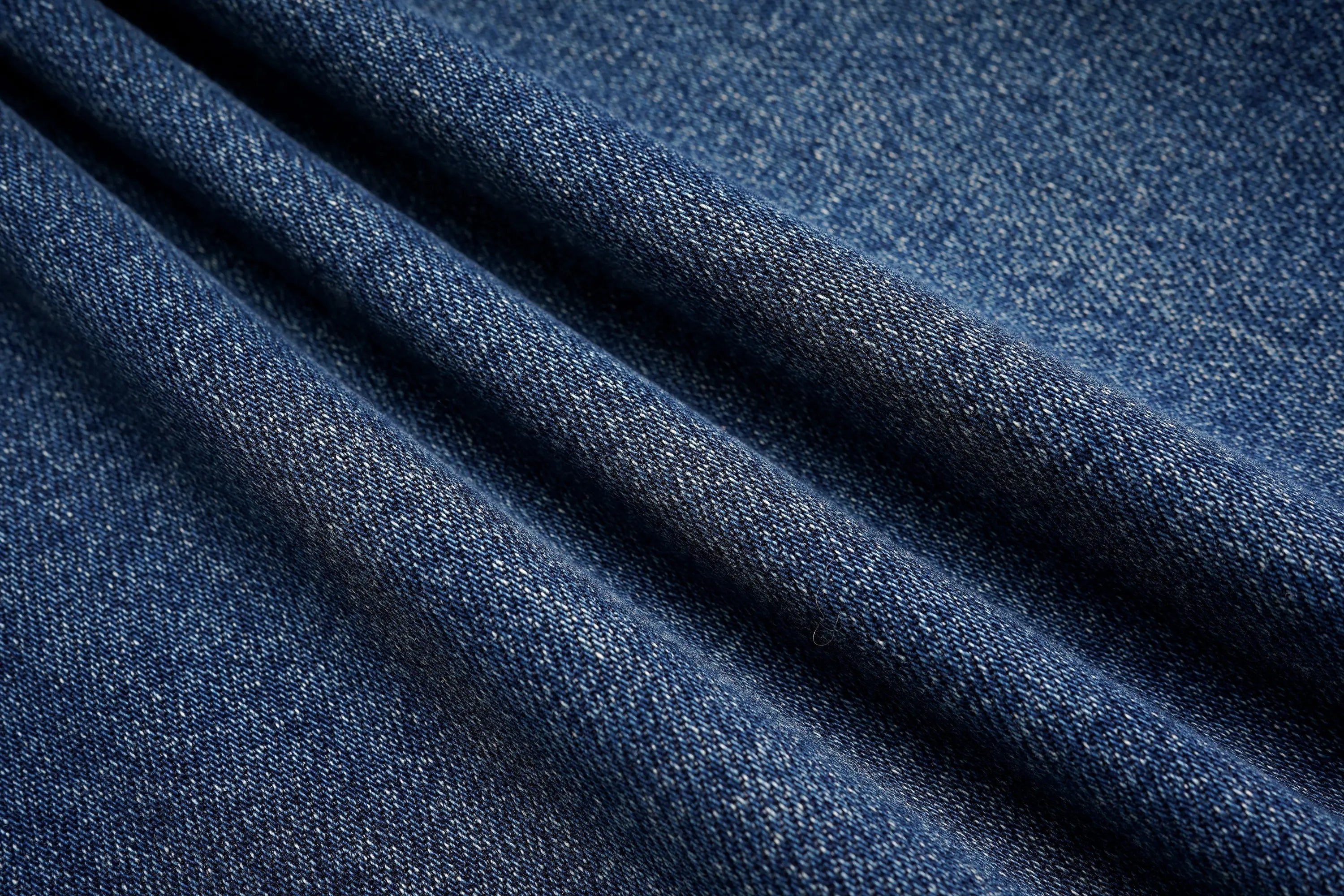 Close-up of blue denim fabric with a textured pattern, TCH Rhinestone Galaxy Sparkle Wide-Leg Jeans