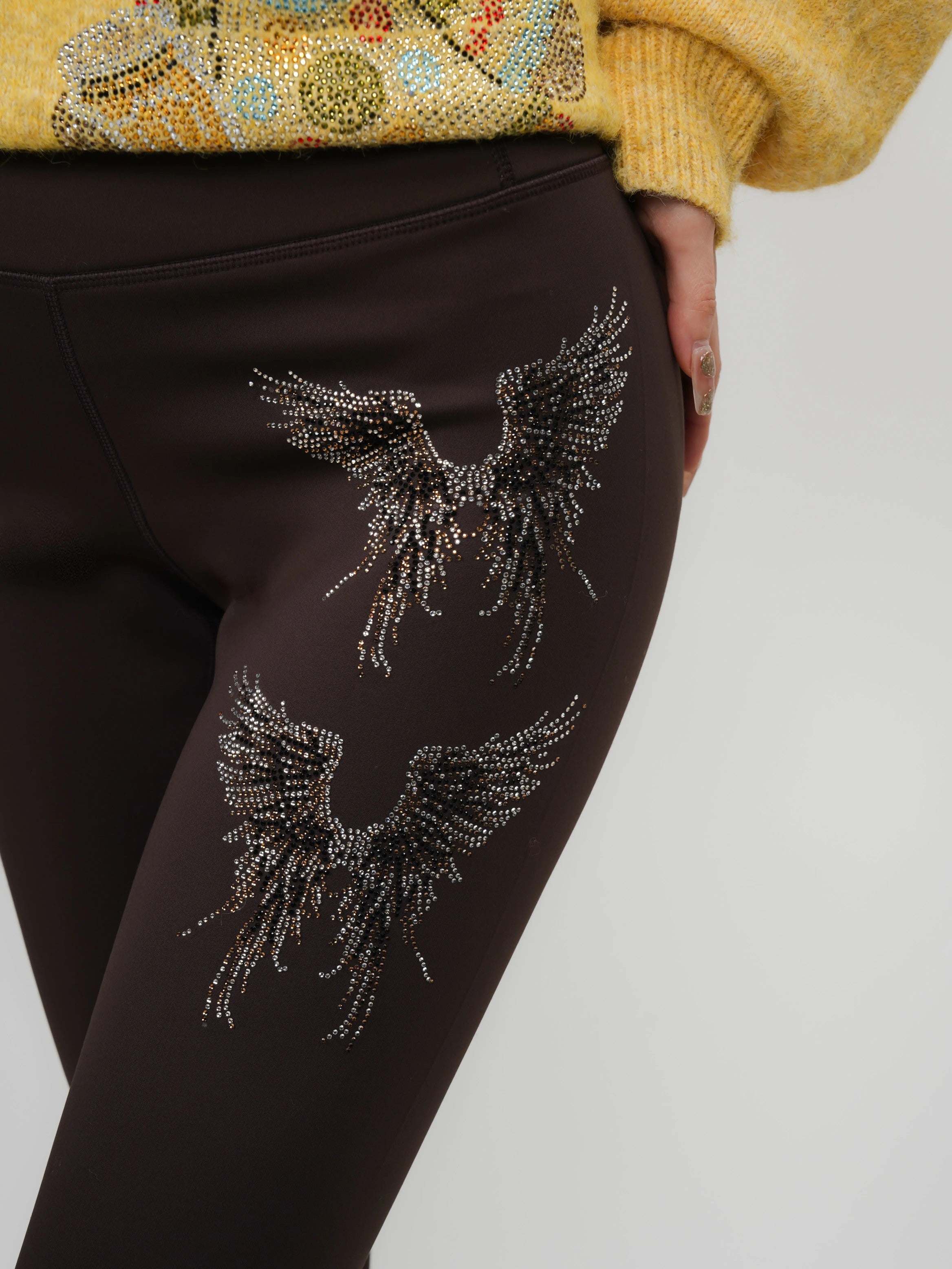 Brown leggings with decorative wings on a plain background, TCH Rhinestone Golden Wings Black High-Waist Leggings