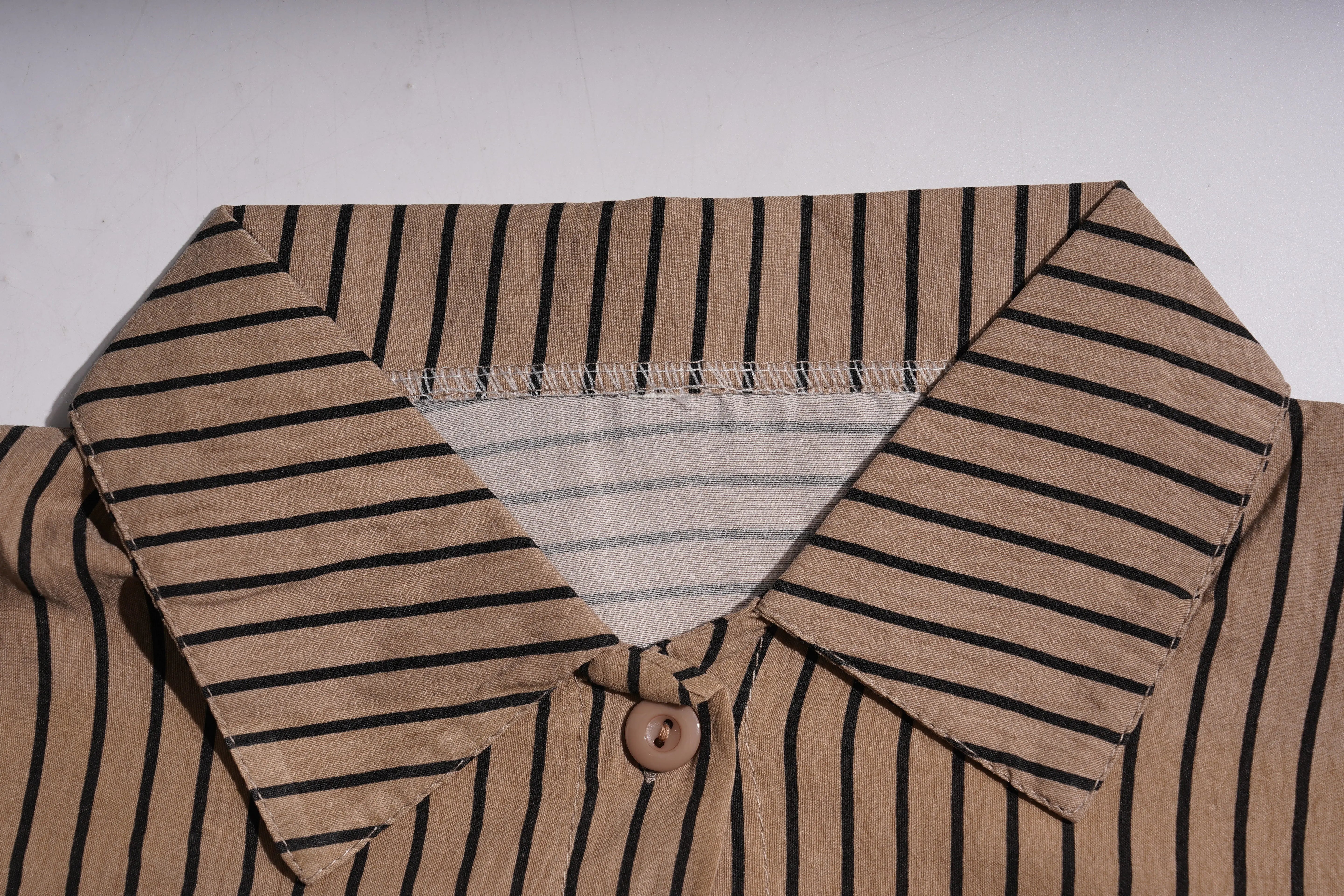 Close-up of a brown shirt with black striped collar and buttons on a white background, TCH Rhinestone Graffiti Cat & Cherry Set
