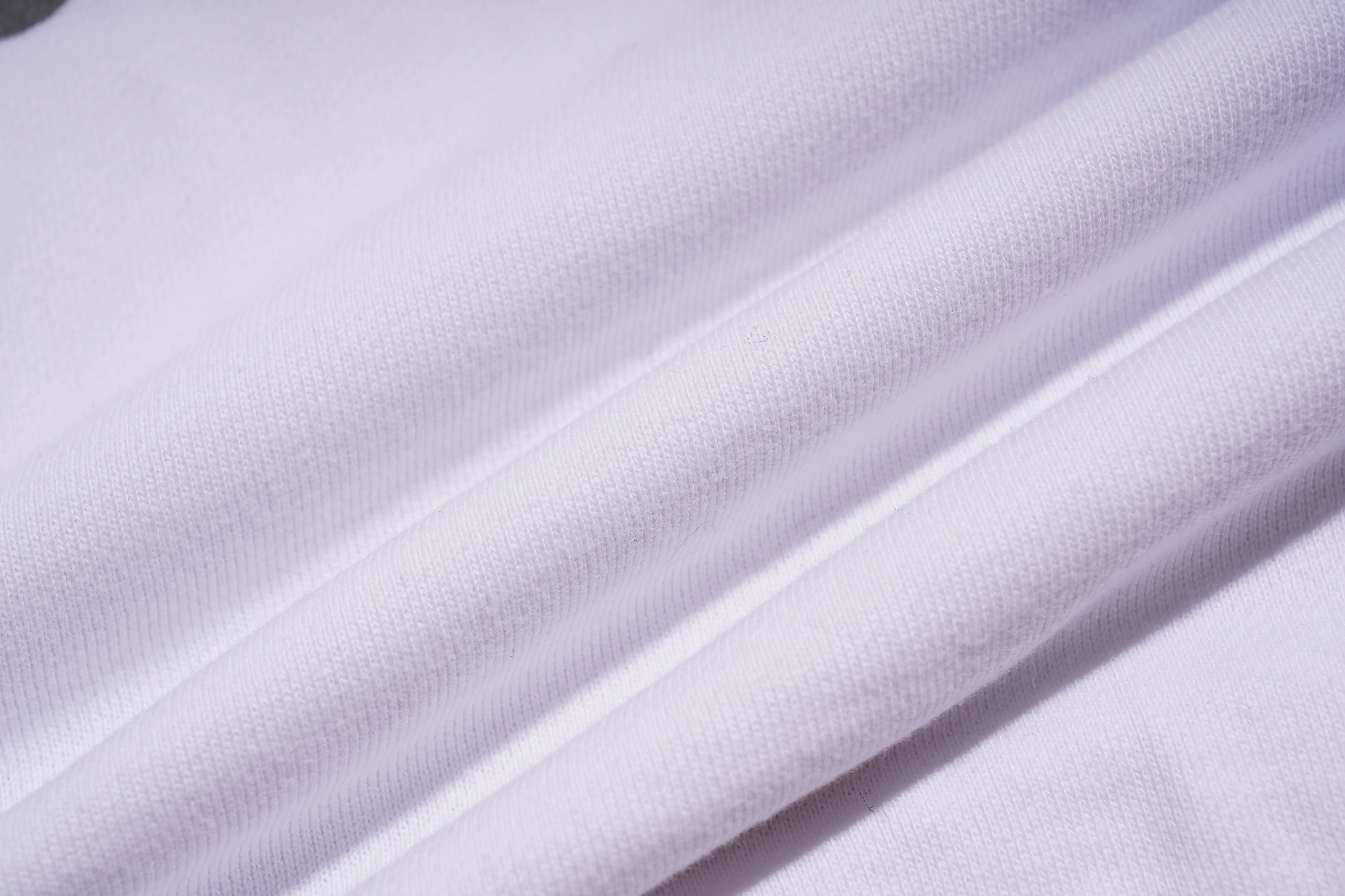 Close-up of white fabric with folds, TCH Rhinestone Hello Kitty BOYLONDON Sweatshirt