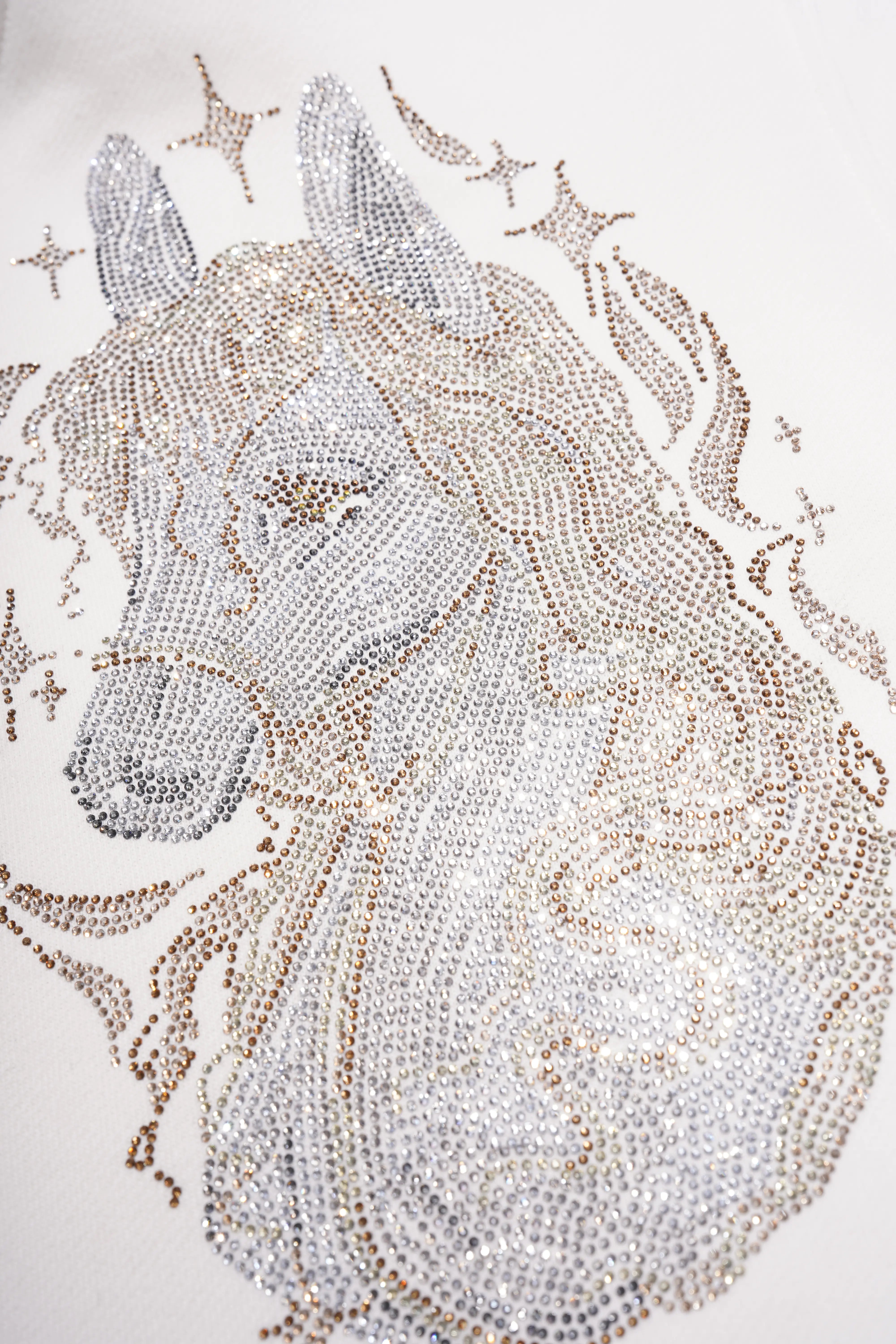 Decorative unicorn head with star accents on a white background, TCH Rhinestone Horse Graphic Jacket