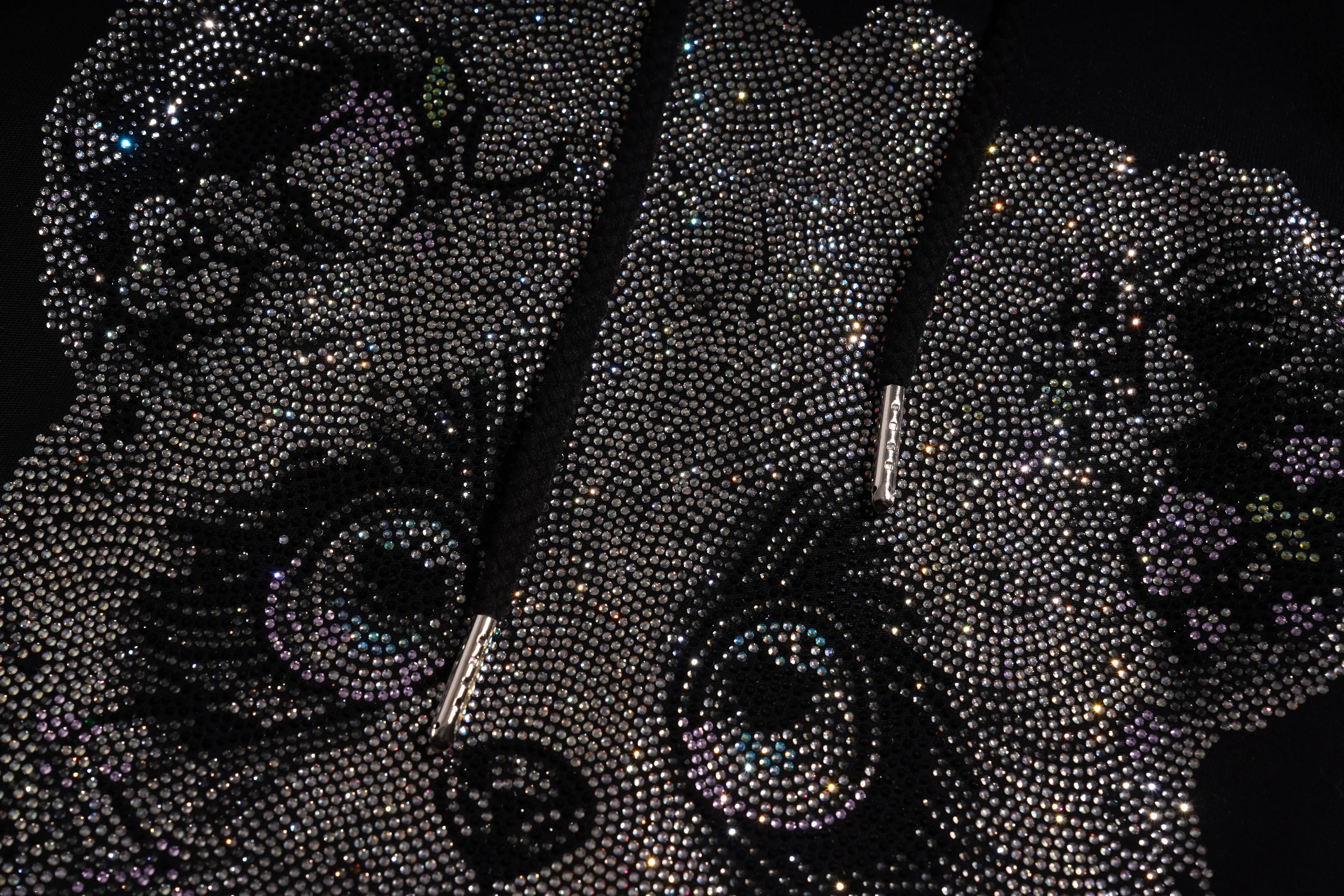 Phone case with black rhinestone embellishments on a black background, TCH Rhinestone Panda Bow Dress