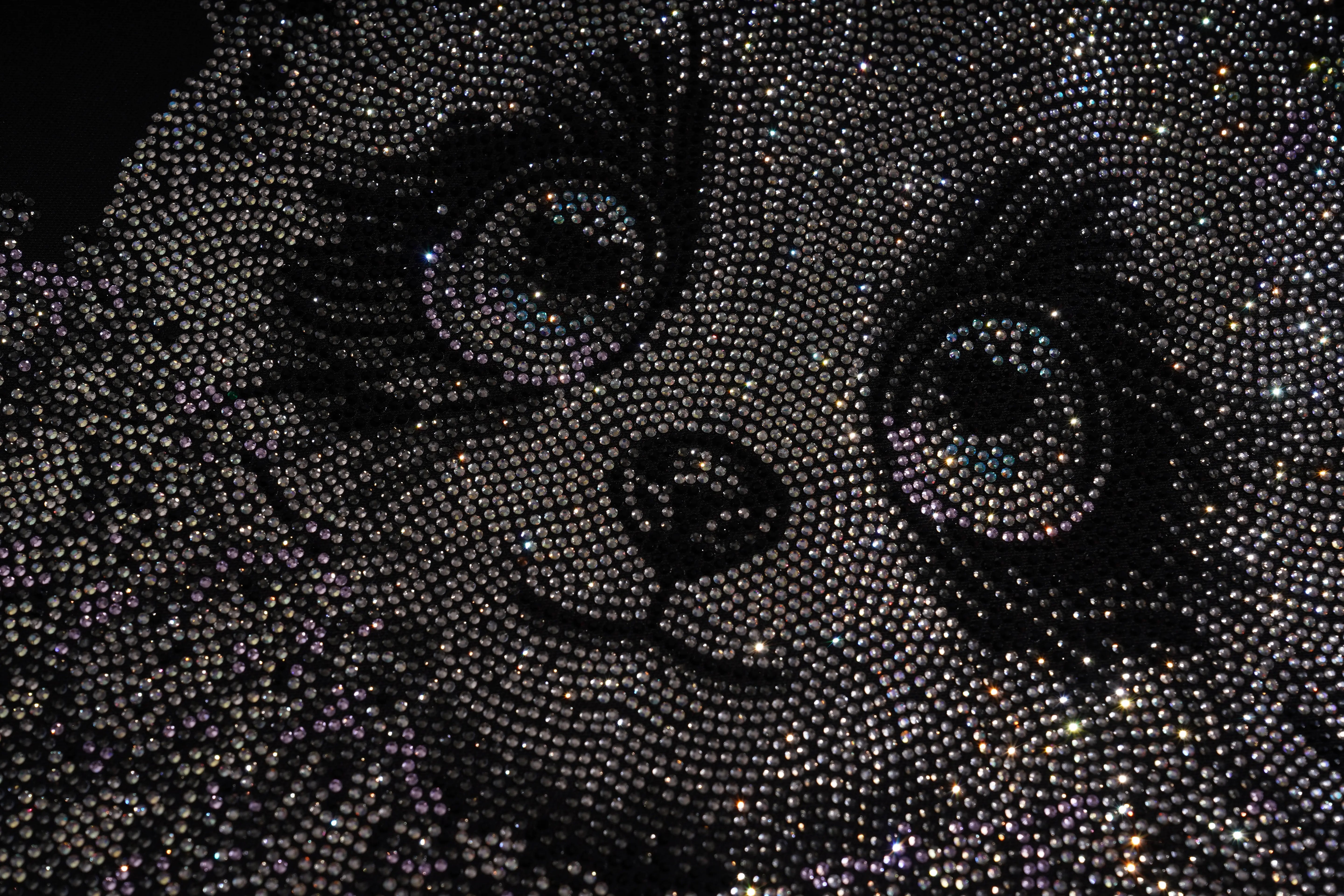 Close-up of a face made from black beads on a dark background, TCH Rhinestone Panda Bow Dress