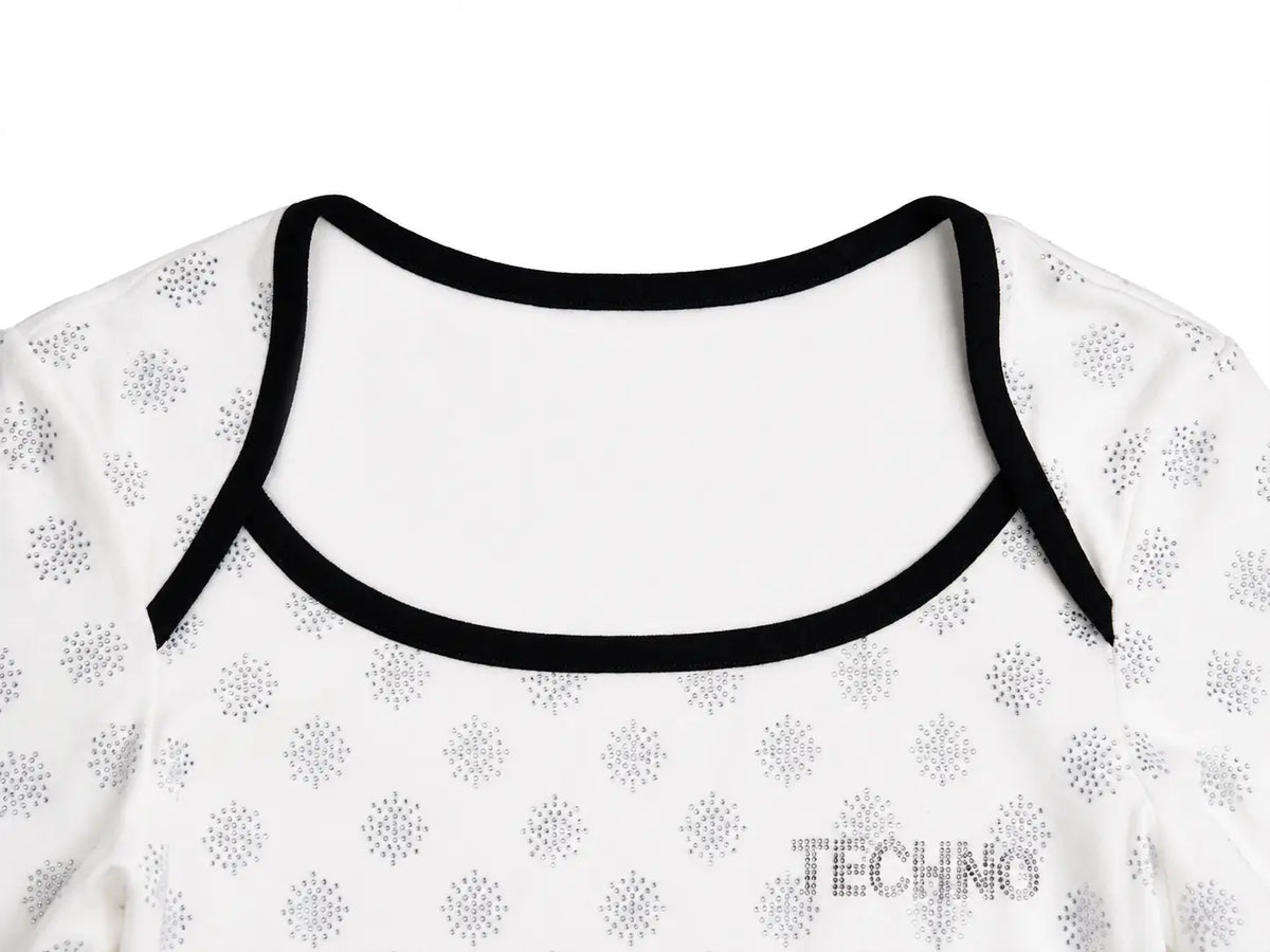 Close-up of a white long-sleeve top with a black scoop neckline trim and a repeating gray circular dot pattern, featuring the brand name 'TECHNO' printed on the front. TCH Rhinestone Pattern Long Sleeve Top