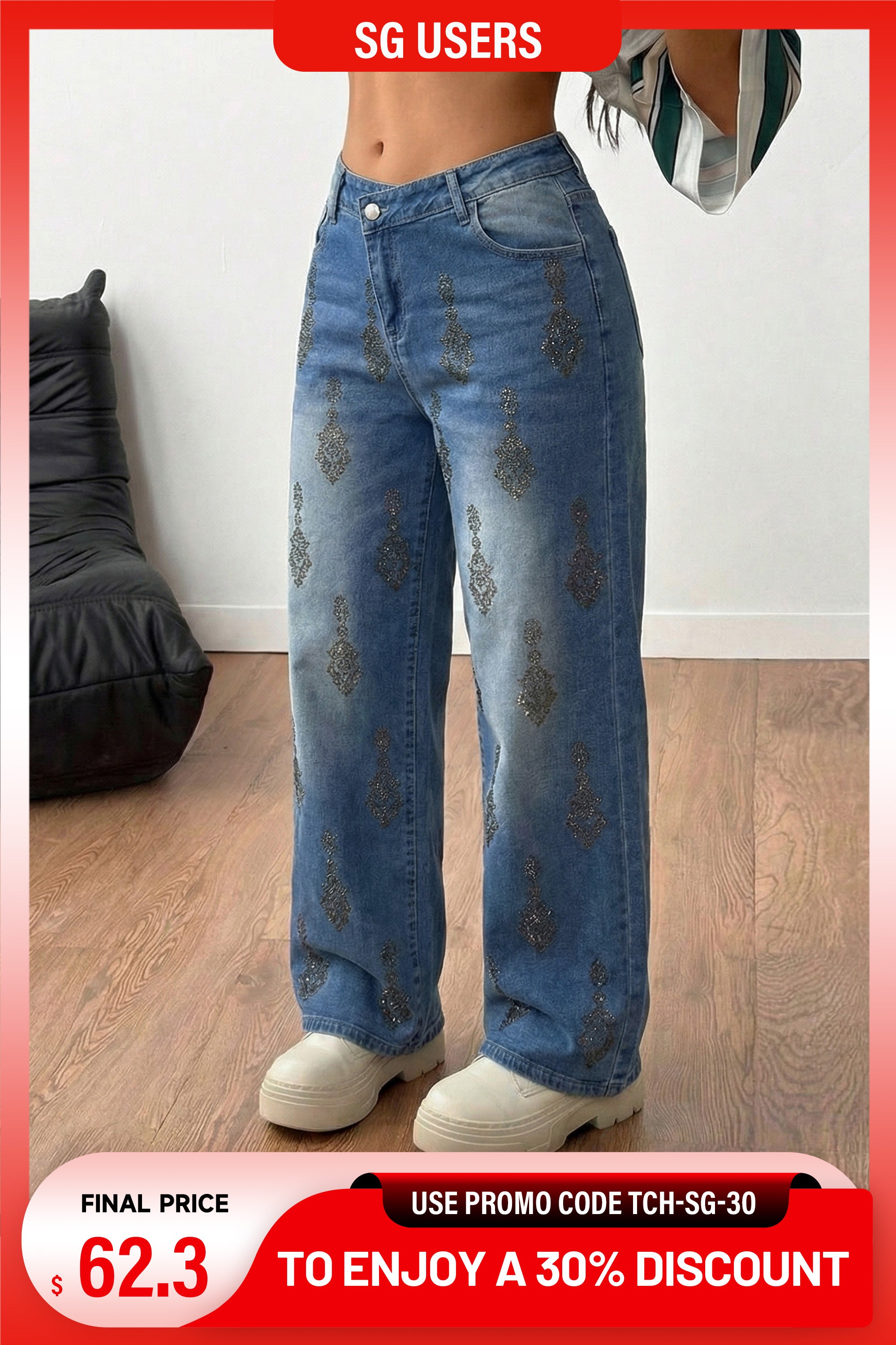 Blue jeans with decorative patterns worn by a person indoors. TCH Rhinestone Pendant Allover Denim Jeans 
