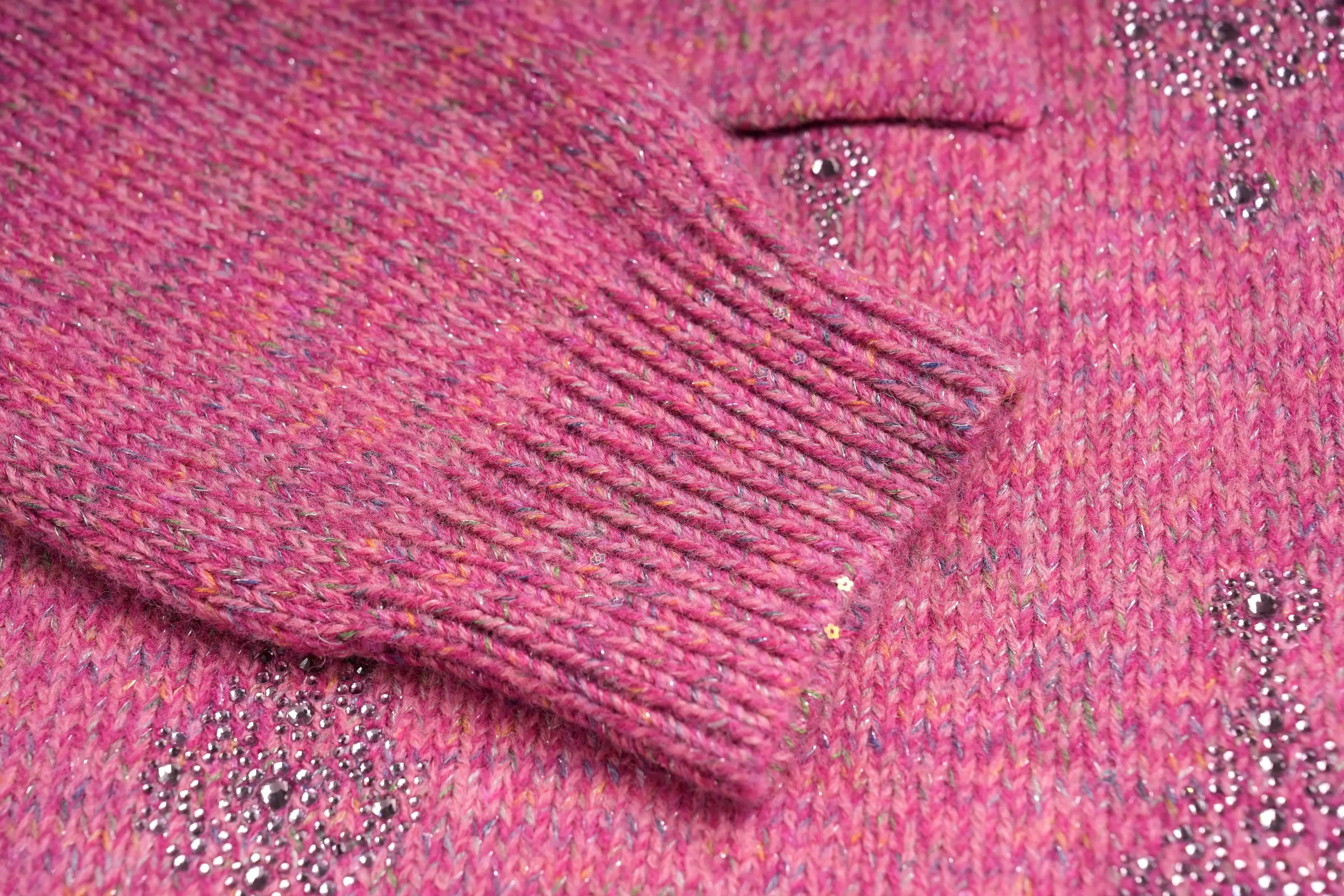 Close-up of a pink textured fabric with sequins, TCH Rhinestone Pendant Pattern Pink Knit Cardigan