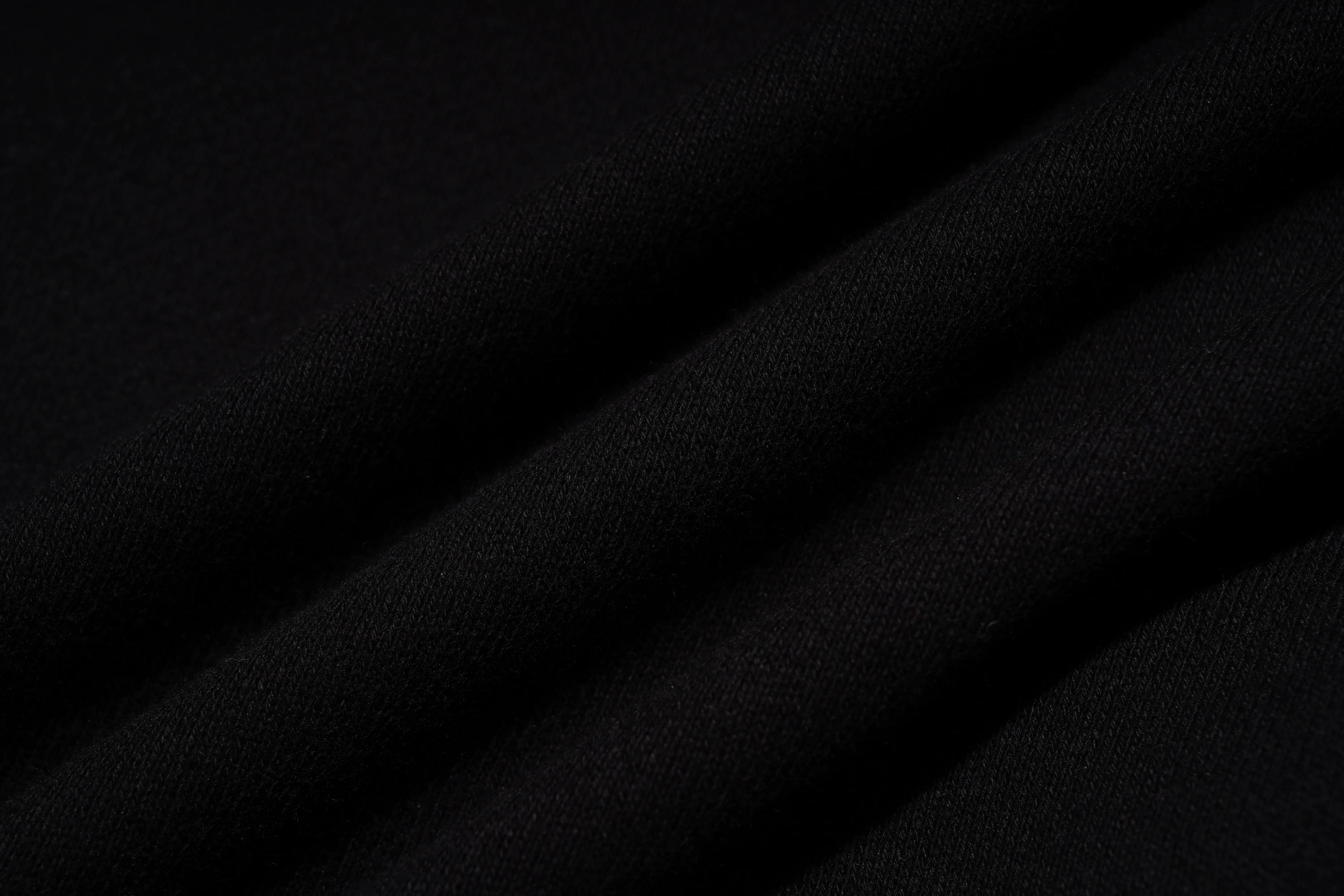 Close-up of black leather texture with folds, TCH Rhinestone Puppy Black Streetwear Sweatshirt