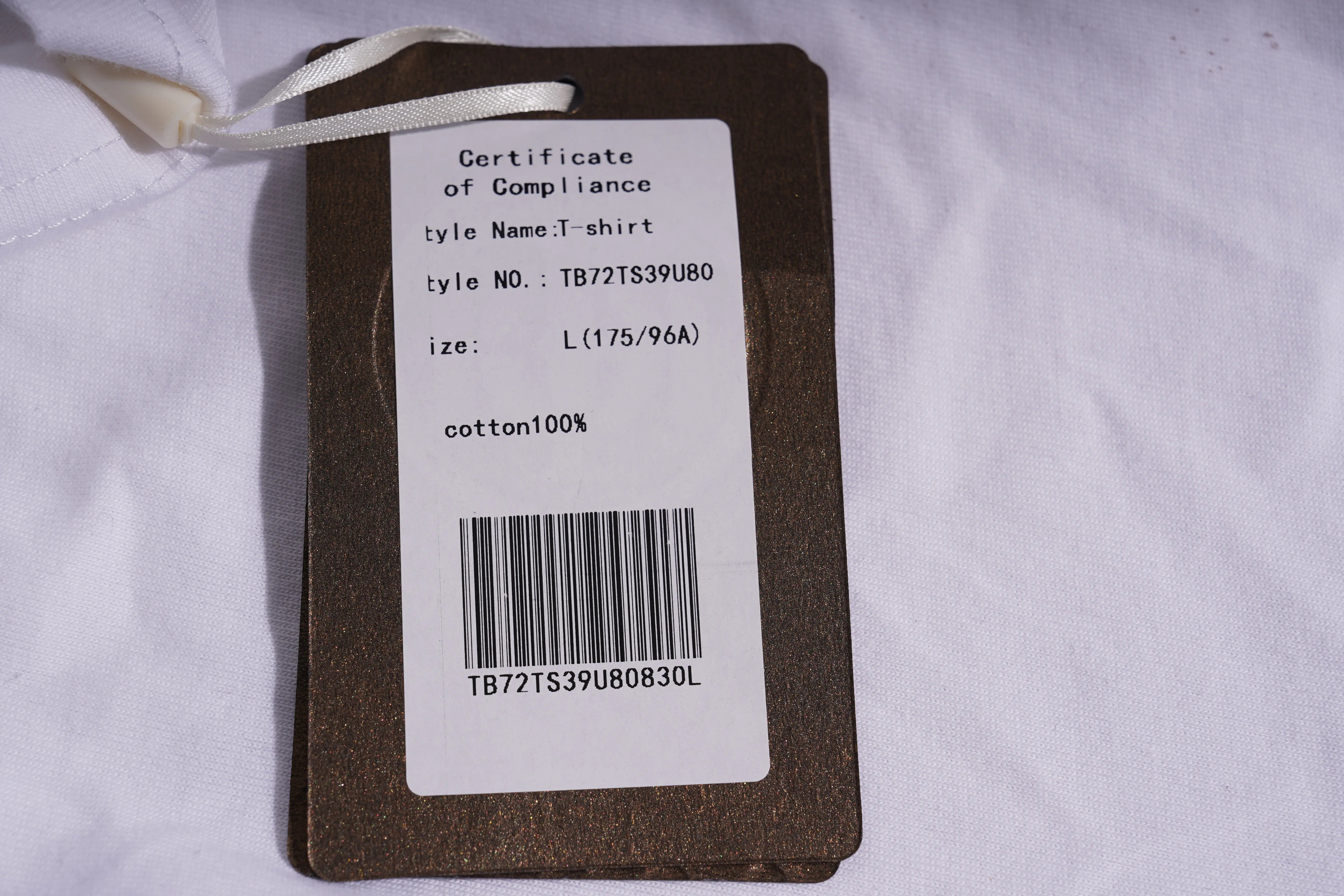 Clothing tag with product details on a white shirt TCH Rhinestone Puppy Bow White T-Shirt-1 