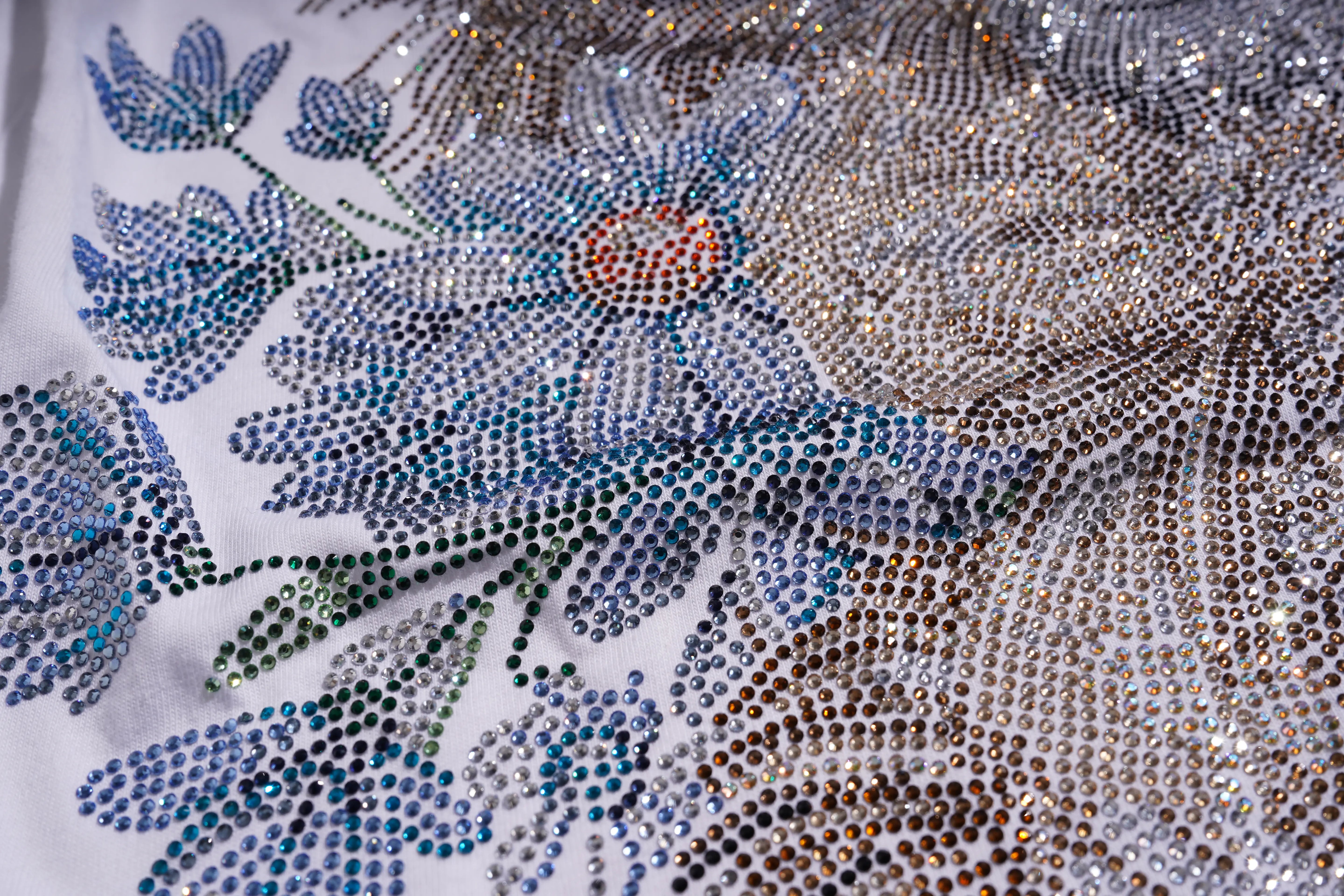 Close-up of a floral pattern with rhinestones on a fabric background TCH Rhinestone Puppy Bow White T-Shirt-7