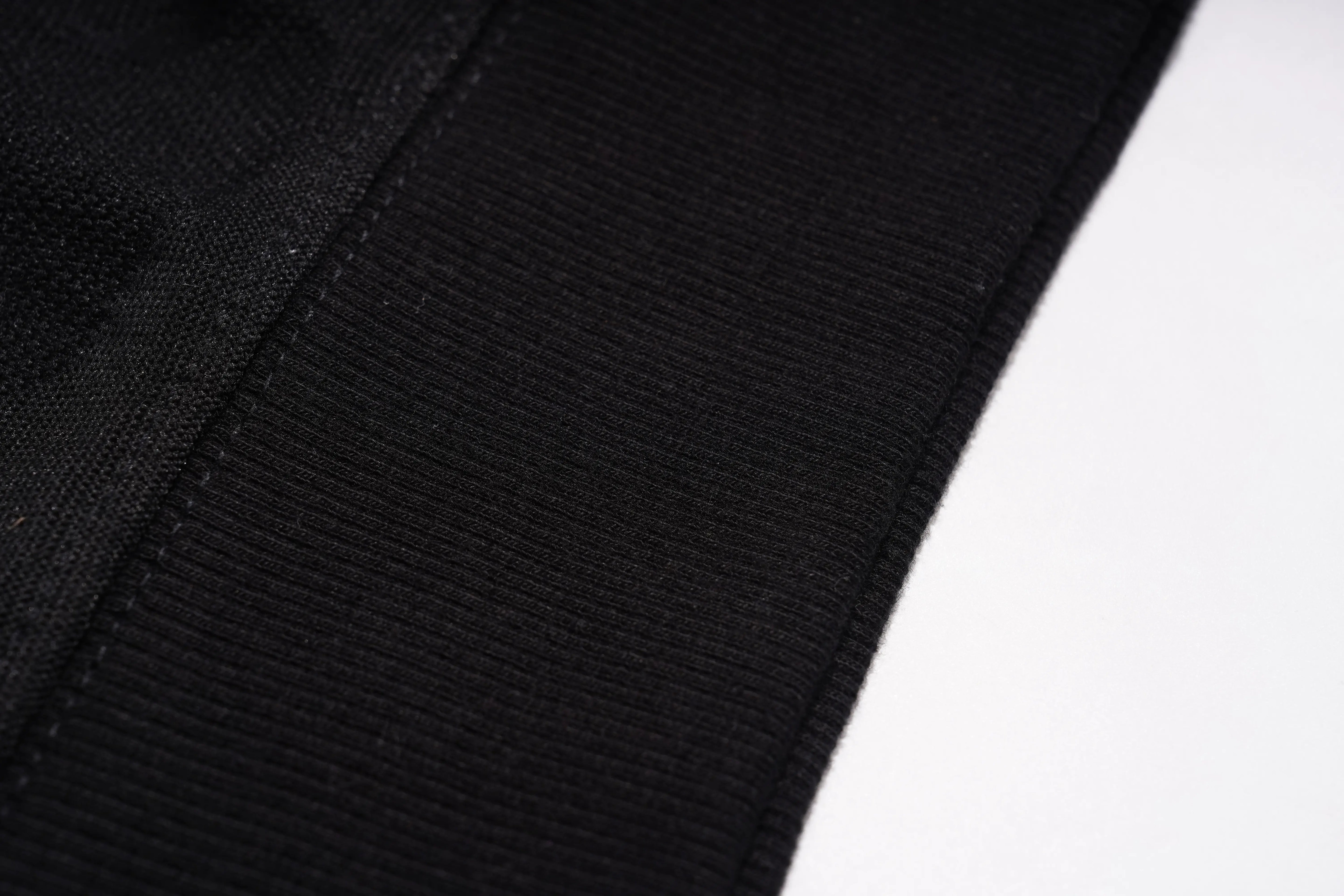 Close-up of black fabric texture on a white background, TCH Rhinestone Snake Black Crewneck Sweatshirt