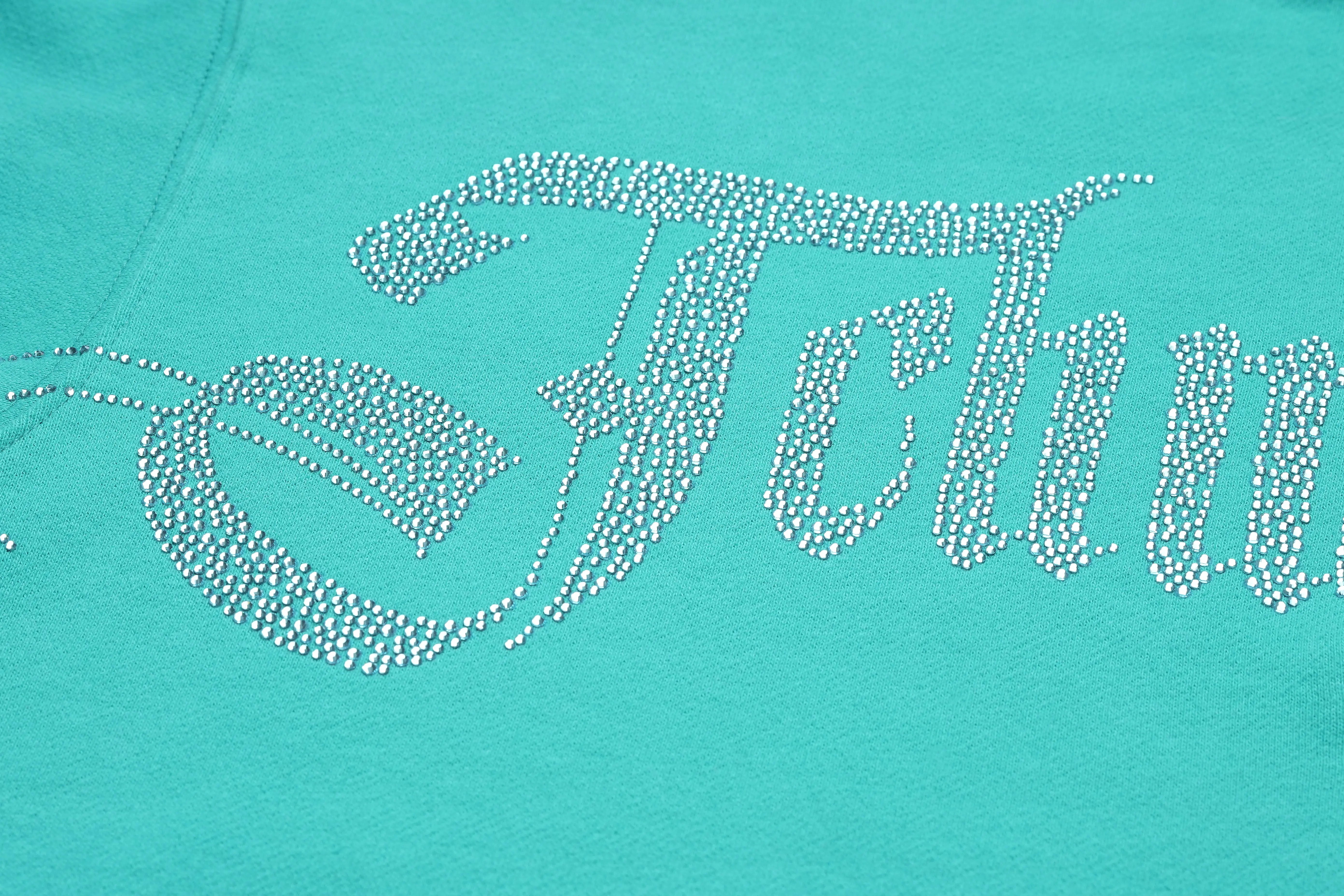 Turquoise hoodie with 'Fetty' text in rhinestones, TCH Rhinestone “Tchmuch” Logo & Wings Teal Zip Tracksuit Set