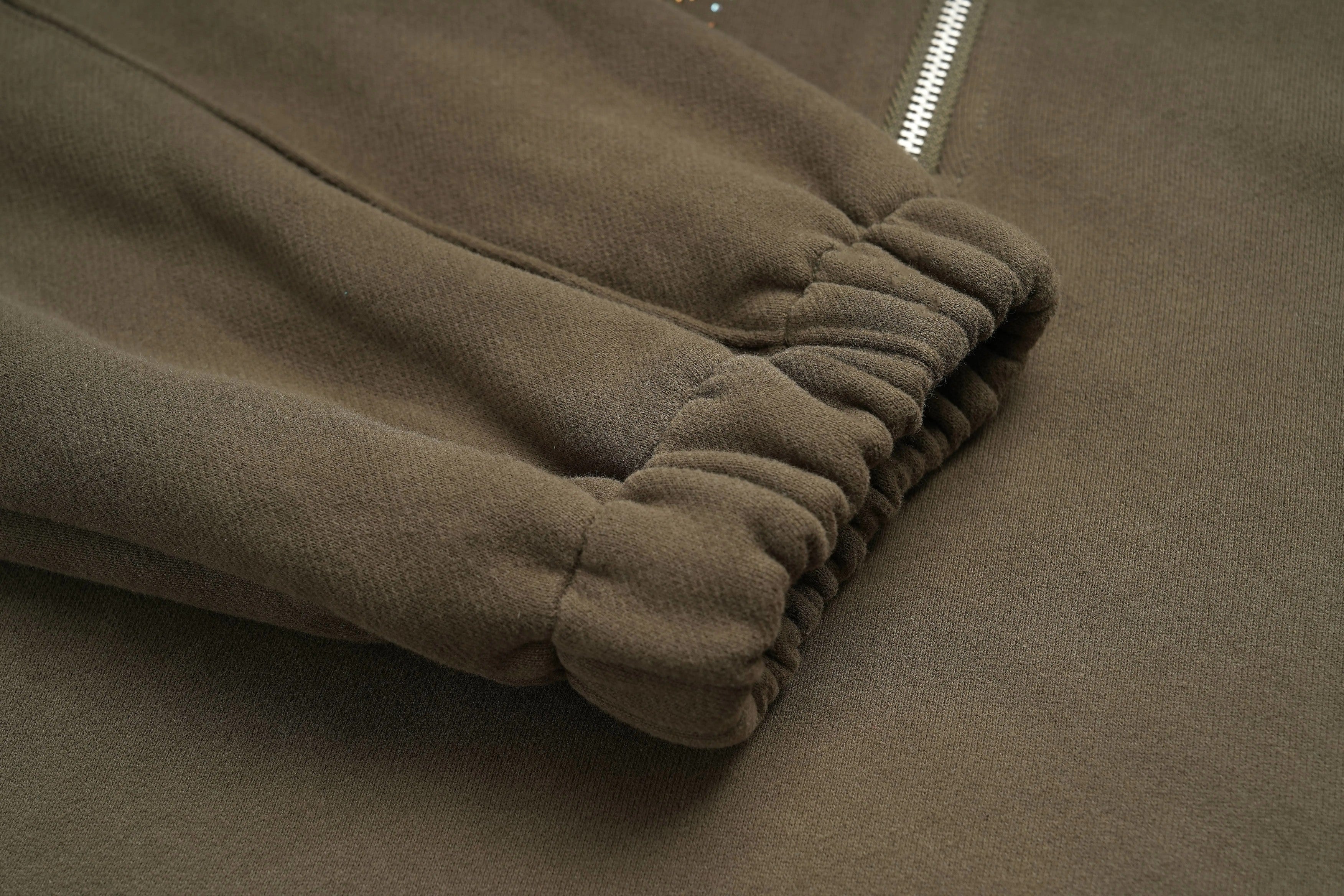 Brown fabric with a folded edge on a matching brown background, TCH Rhinestone Teddy Bear Military Green Zip Turtleneck Set