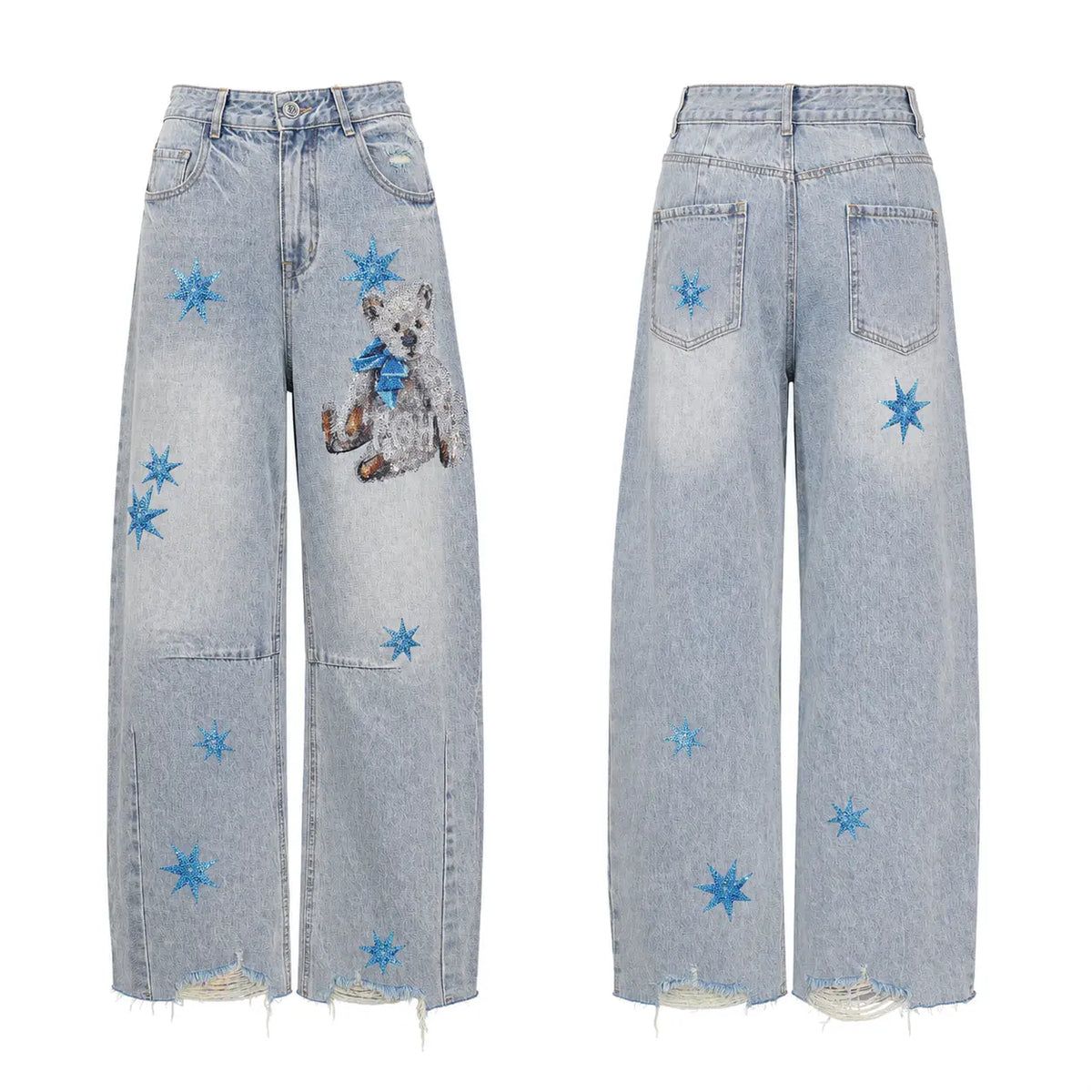 Light-wash blue denim jeans shown from the front and back, featuring embroidered blue star motifs, a teddy bear patch on the front left leg, and distressed frayed hems. TCH Rhinestone Teddy Bear Star Wide-Leg Jeans