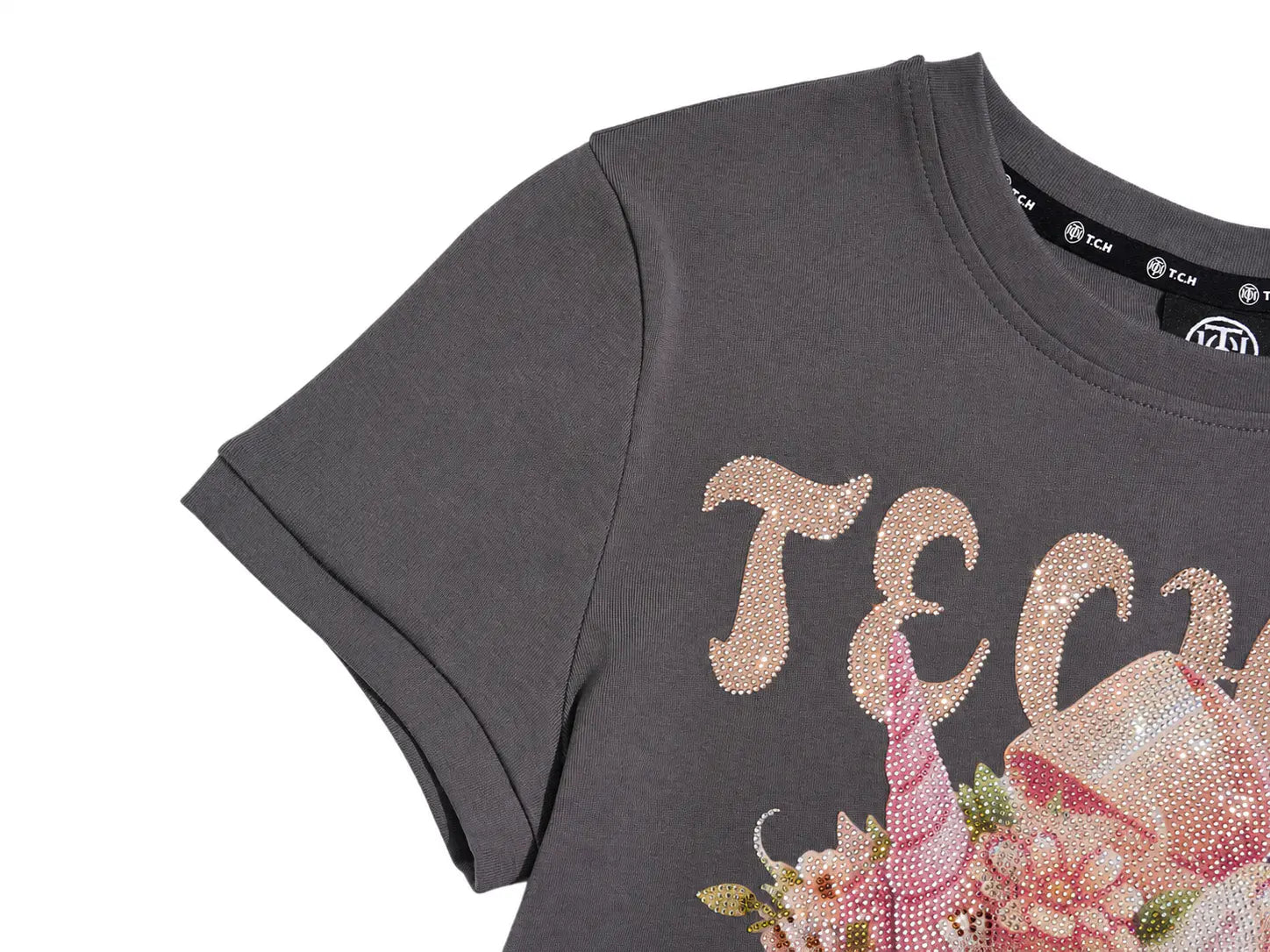 Close-up of a dark gray short-sleeve T-shirt with a sequined graphic on the front. The design features large rose-gold sequined letters and a pink unicorn and floral motif. TCH Rhinestone Unicorn Graphic Charcoal T-Shirt