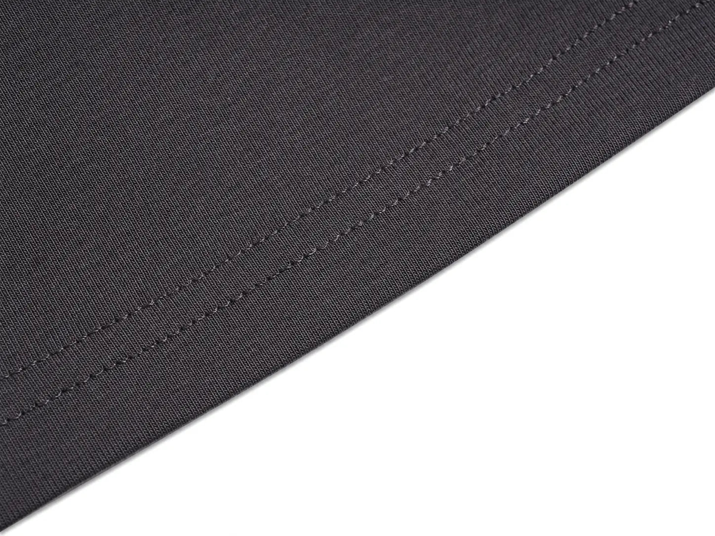 Close-up of a dark charcoal gray fabric with fine diagonal stitching, shown against a solid white background. TCH Rhinestone Unicorn Graphic Charcoal T-Shirt