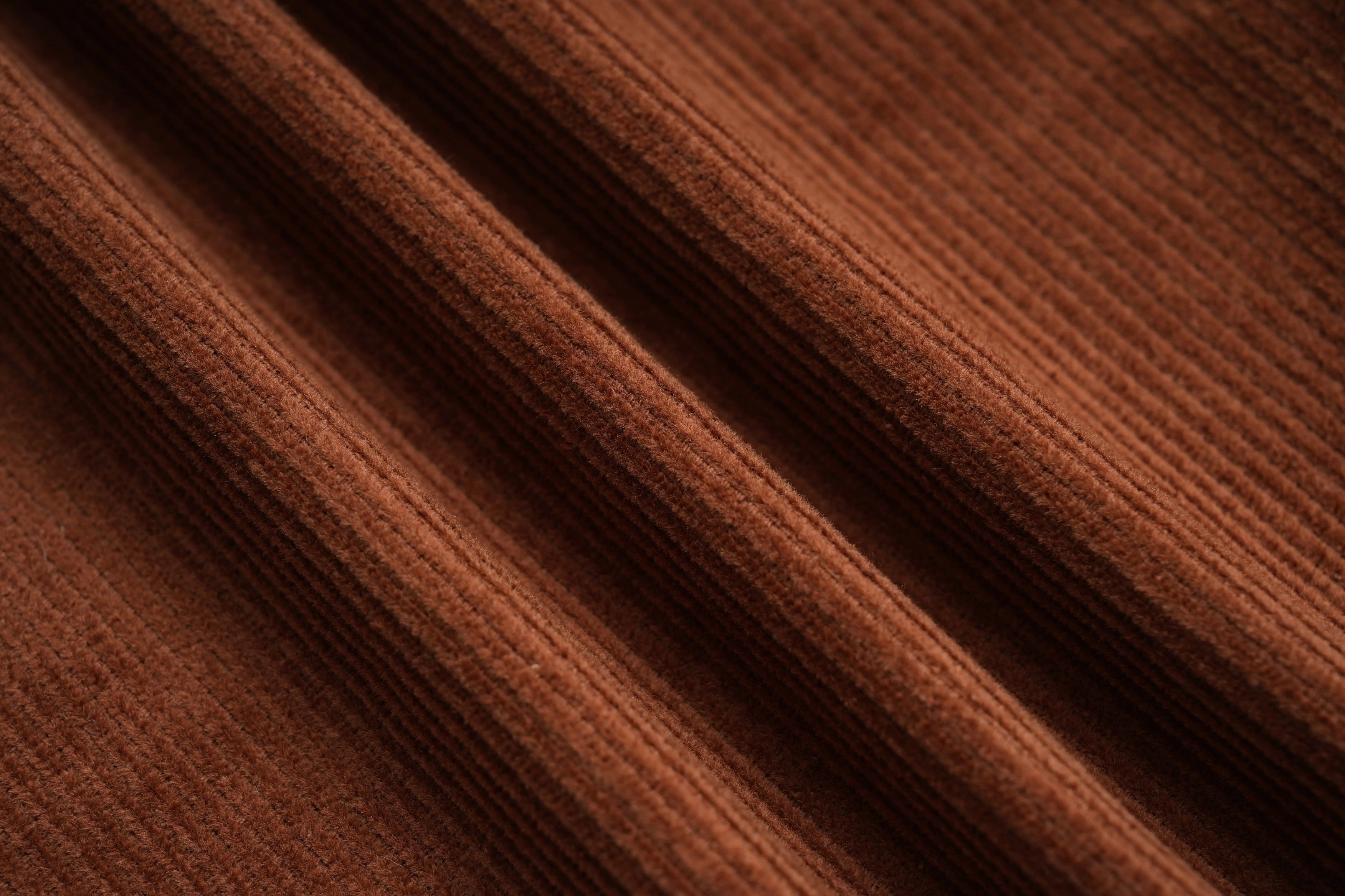 Close-up of brown fabric with visible texture, TCH Rhinestone Vine Brown Denim Jeans