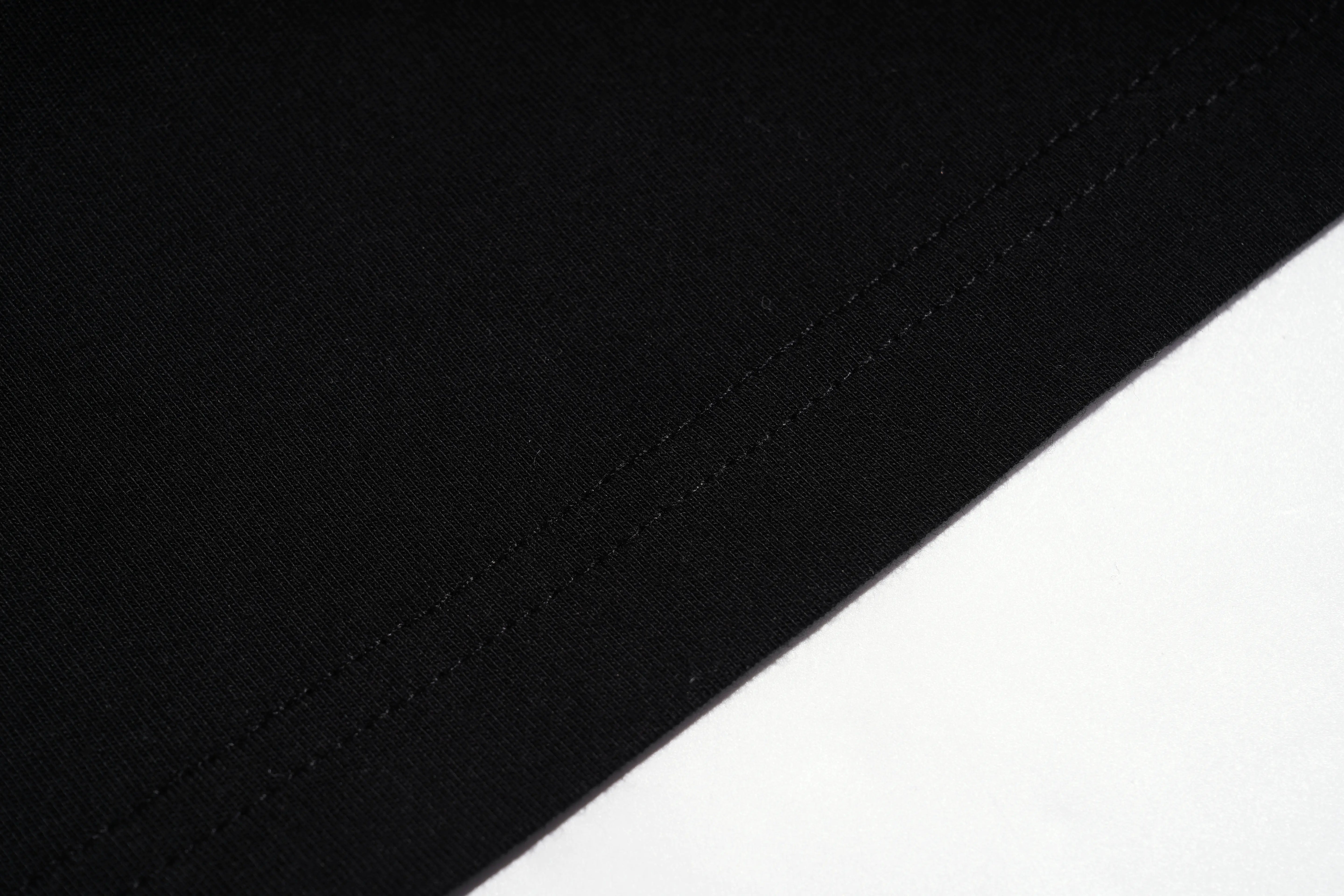 Close-up of black fabric on a white background TCH Rhinestone Vintage Floral Artwork Graphic Black T-Shirt