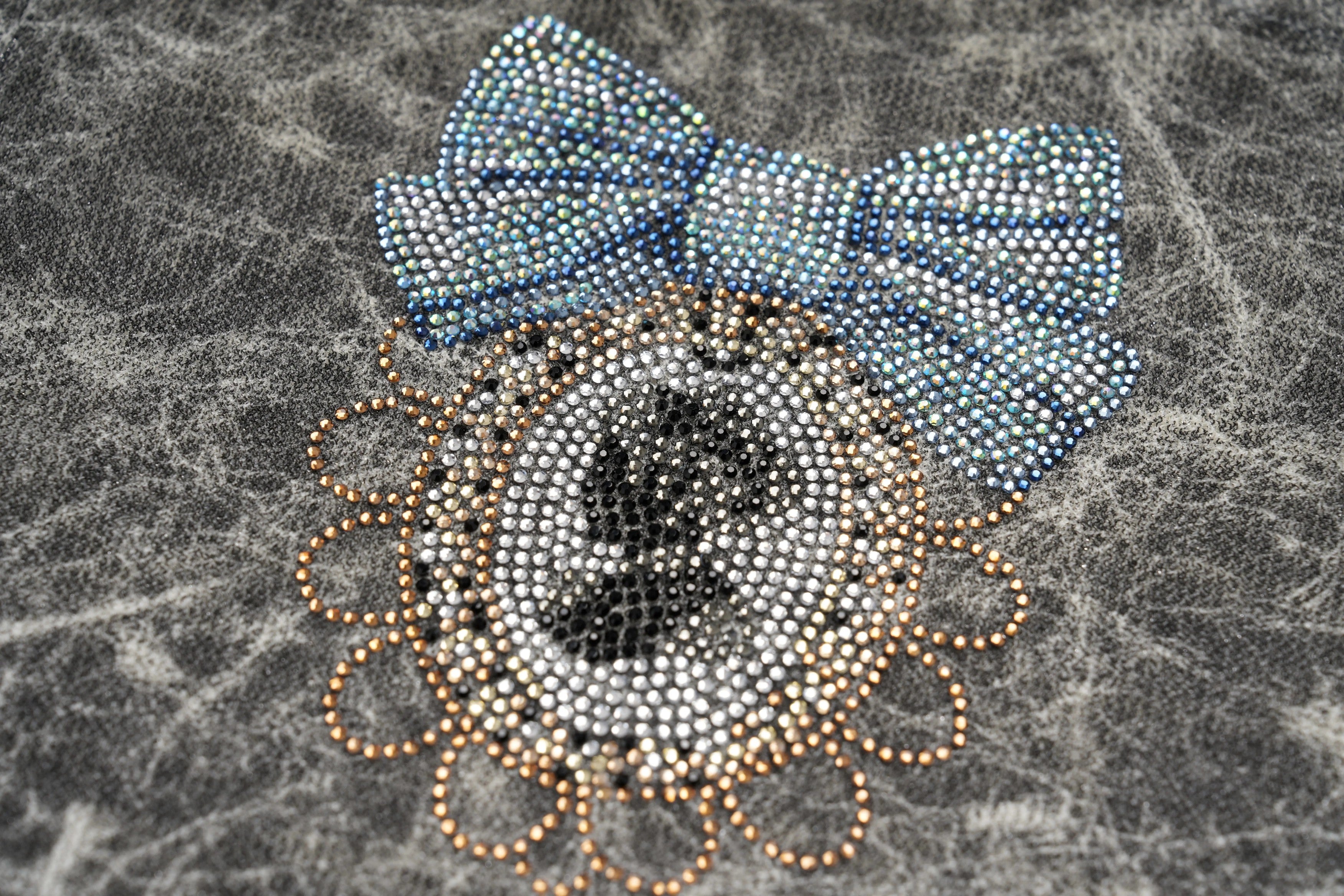 Decorative brooch with a blue bow and circular design on a textured gray background, TCH Rhinestone Web Mirror Slim-Fit Long Sleeve Tee