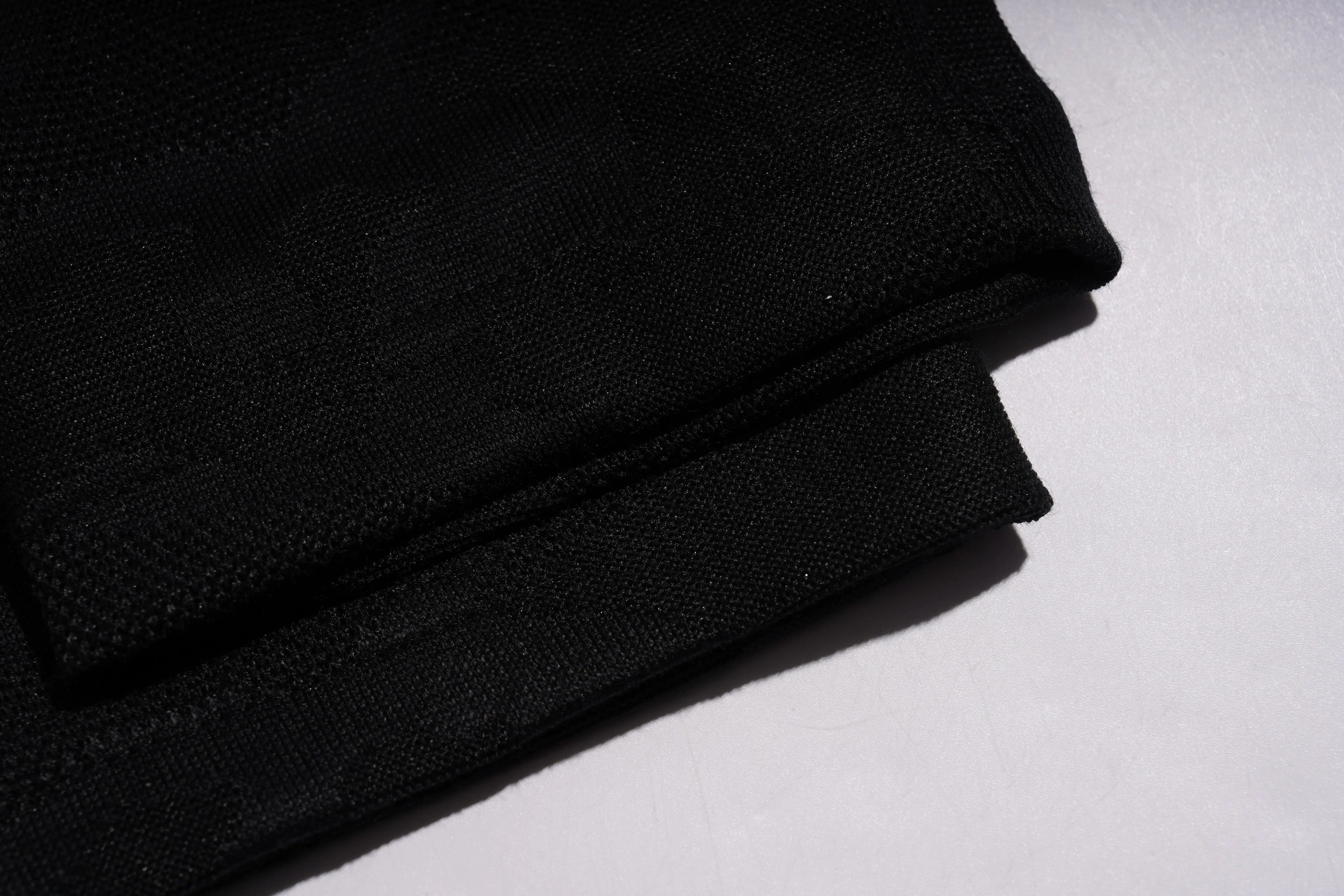 Stack of black fabric on a white background, TCH Rhinestone Wing Camo Jogger Pants