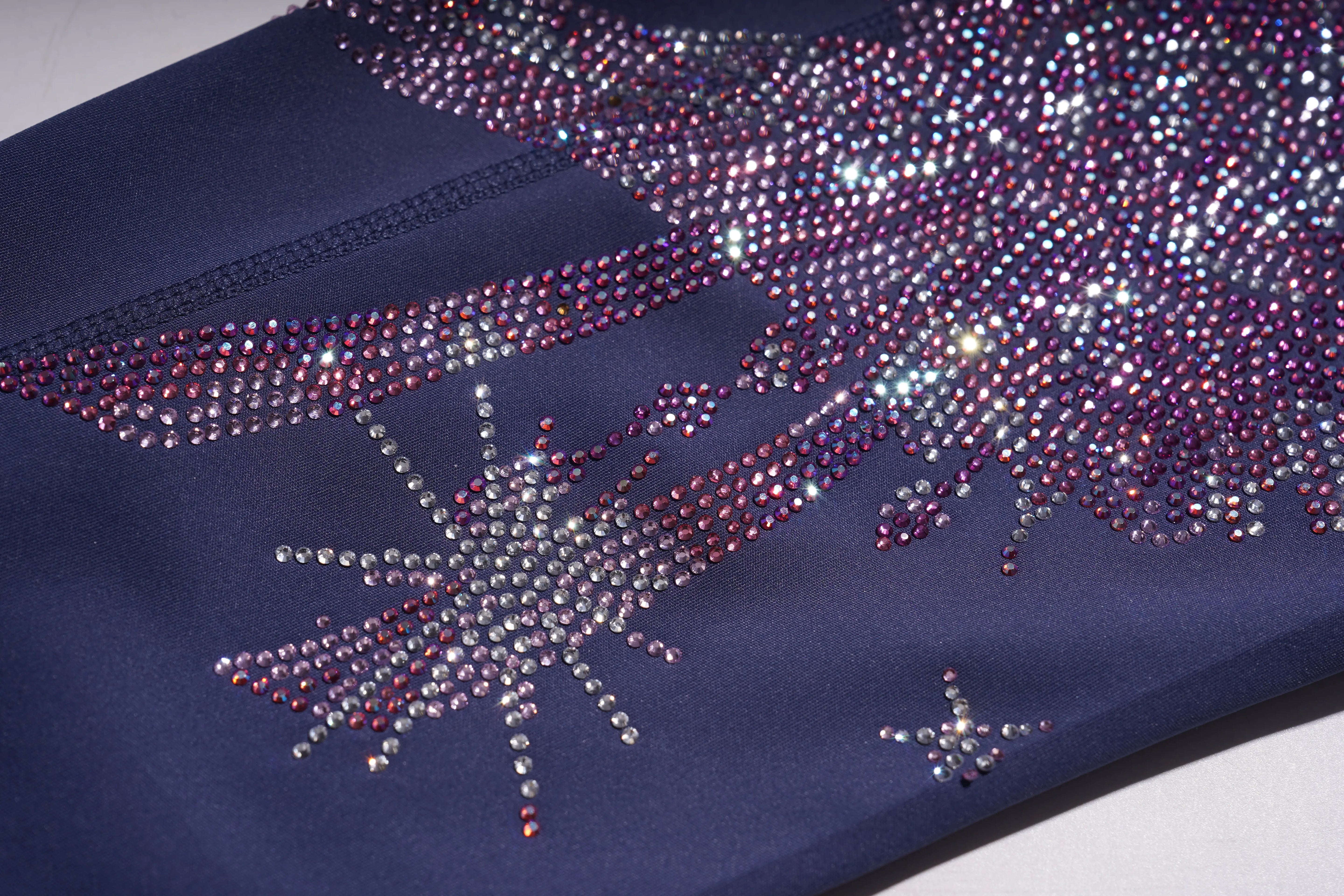 Navy blue fabric with decorative rhinestone pattern on a white background， TCH Rhinestone Wing Graphic High-Waist Leggings