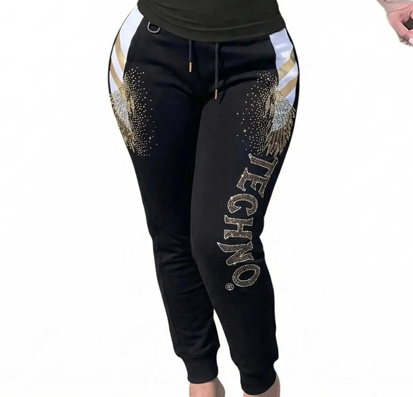 Black jogger pants with gold and white embellishments and 'TECHNO.' text on a white background, TCH Rhinestone Wing Techno Jogger Pants