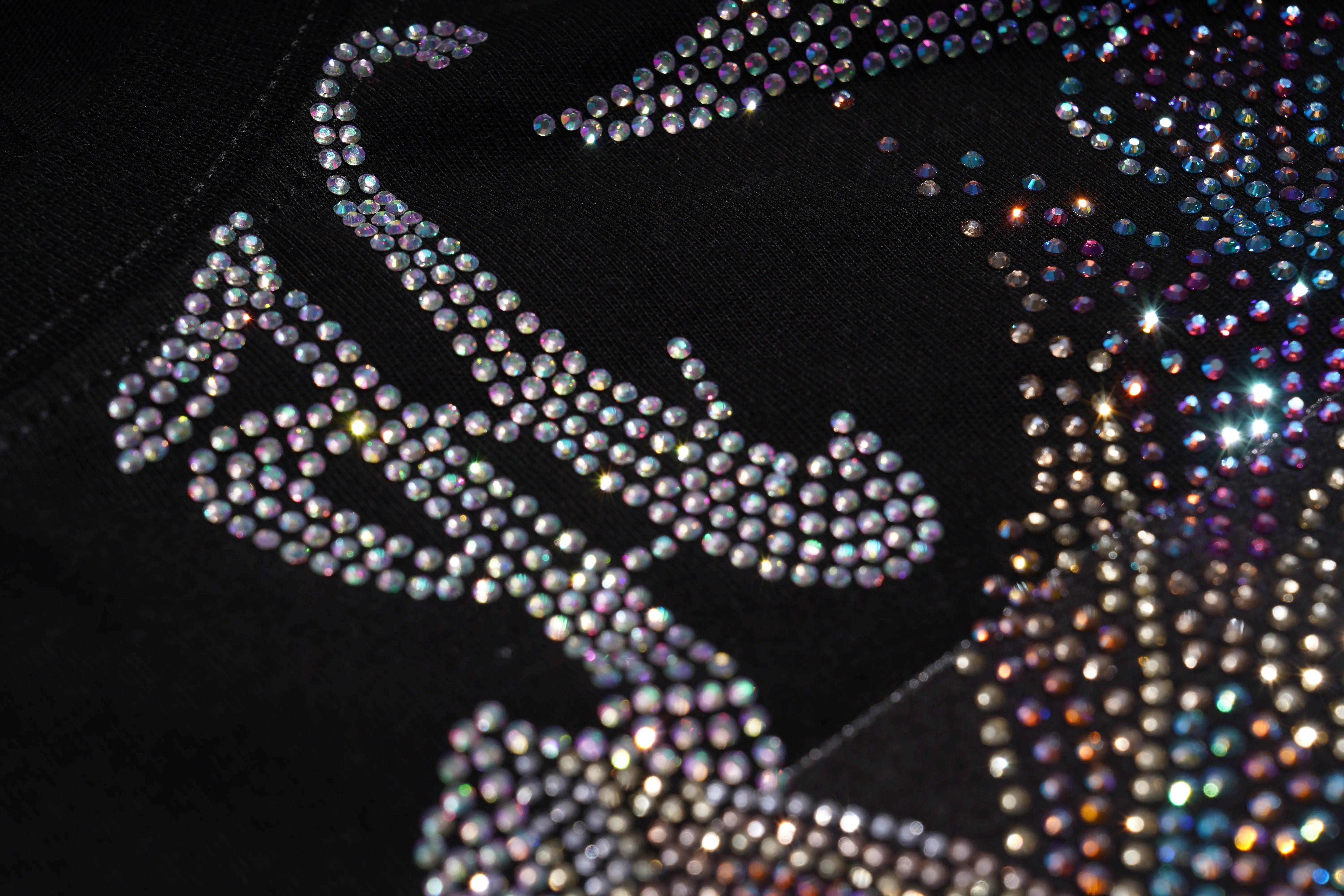 Close-up of a rhinestone design on a black background, TCH Rhinestone Winged Unicorn T-Shirt