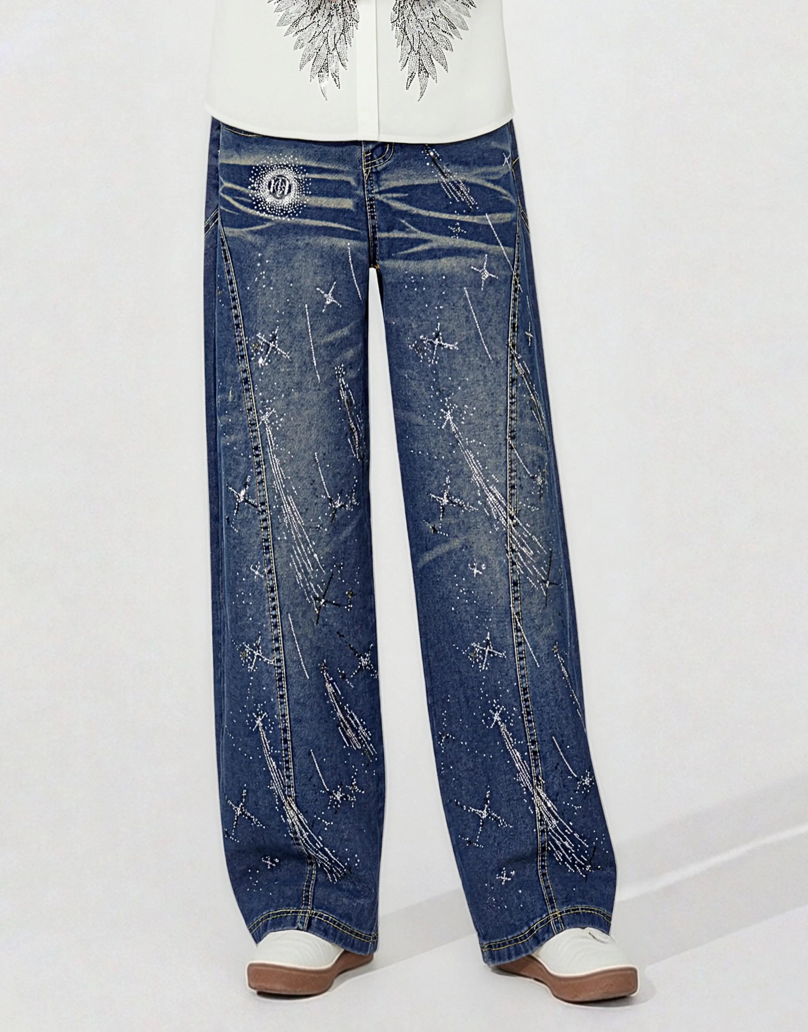 Black pants hanging on a wooden hanger against a white background, TCH Shooting Star Rhinestone Wide-Leg Blue Jeans