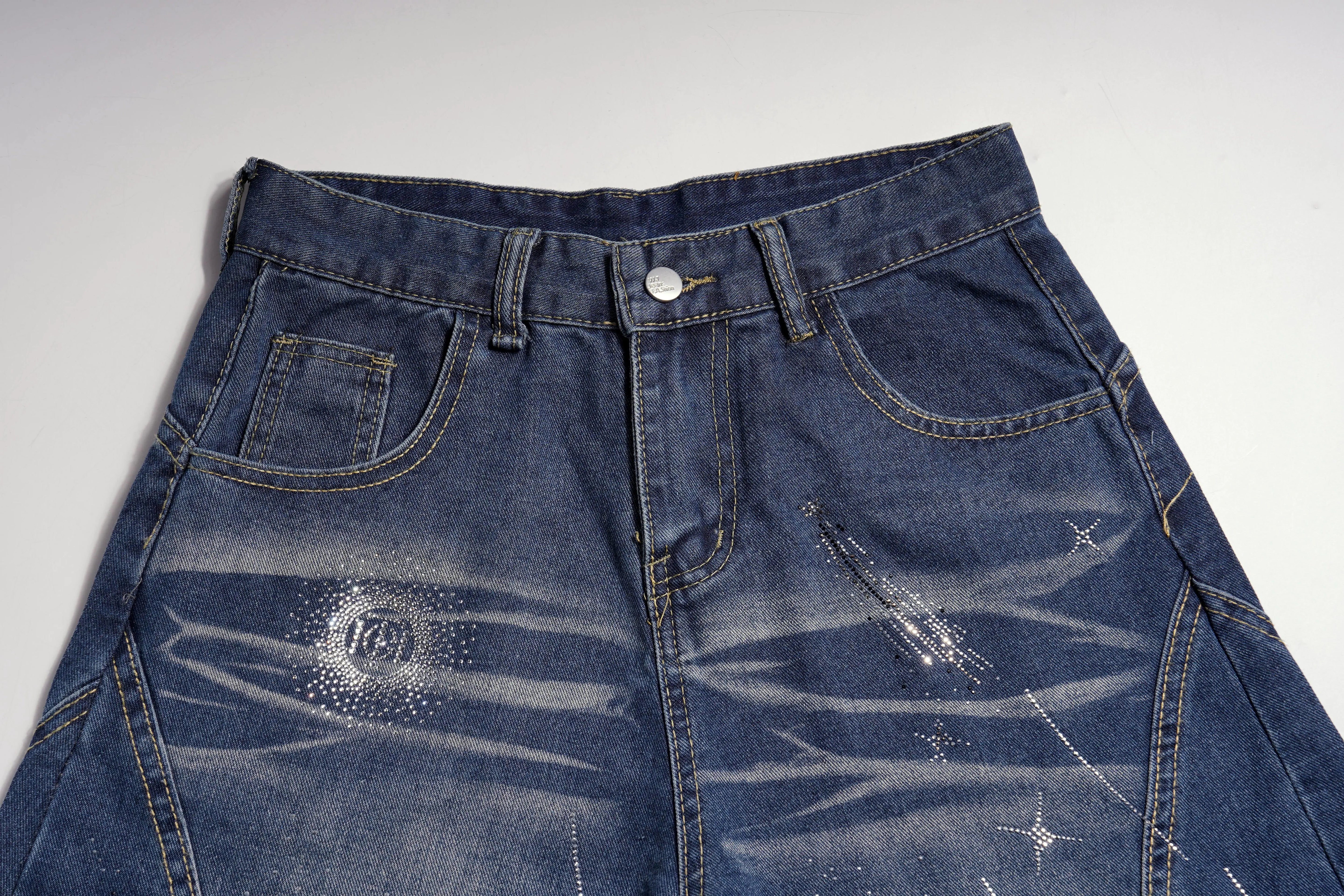 Blue denim jeans with visible wear and tear on a white background, TCH Shooting Star Rhinestone Wide-Leg Blue Jeans