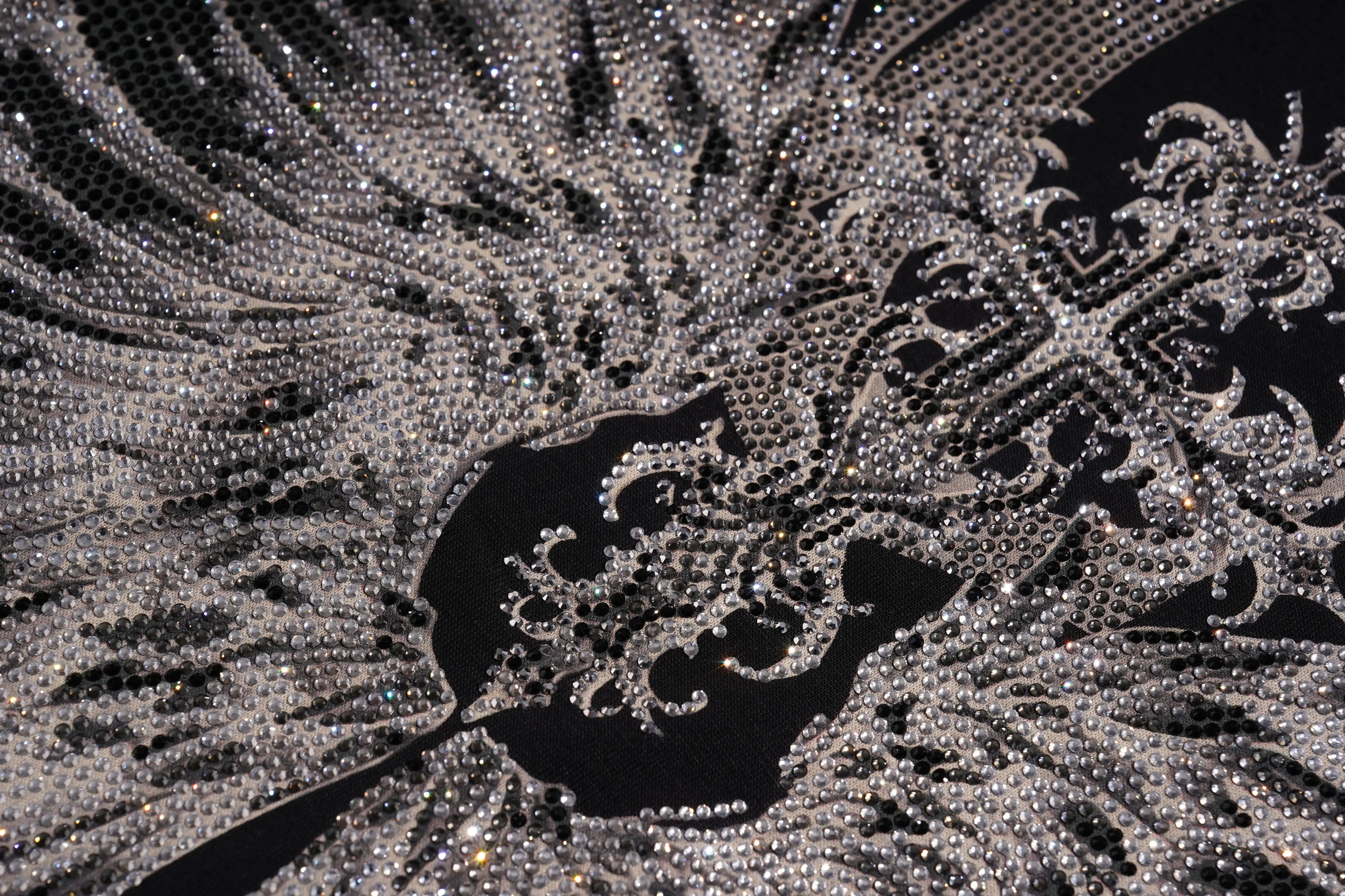 Close-up of a mustard yellow knit garment, likely a skirt or shorts, featuring a ribbed waistband and matching drawstring. TCH Silver Wing Techno Oversized Graphic T-Shirt