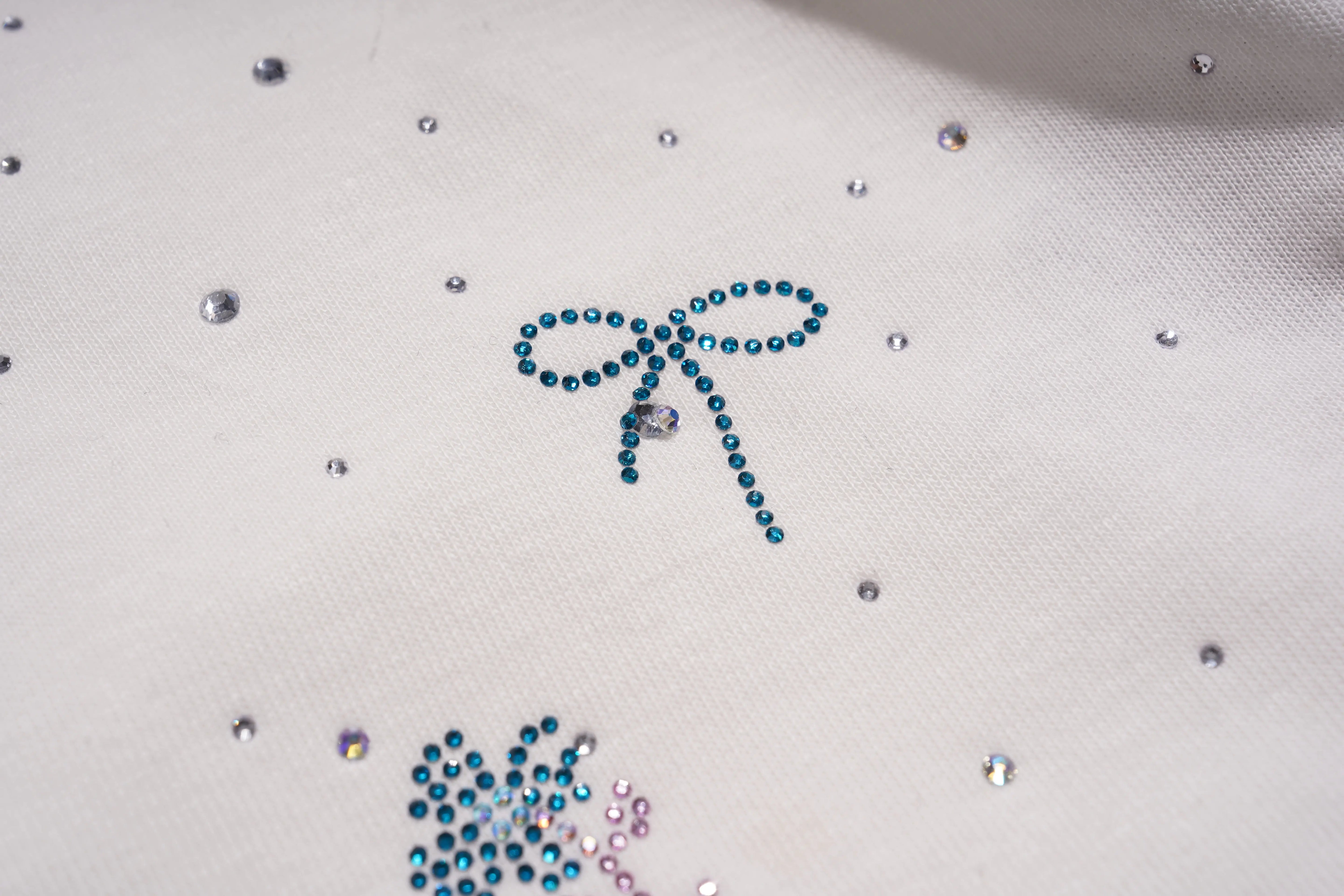 Decorative design with rhinestones on a white fabric background, TCH Starry Gradient Rhinestone Butterfly T-Shirt