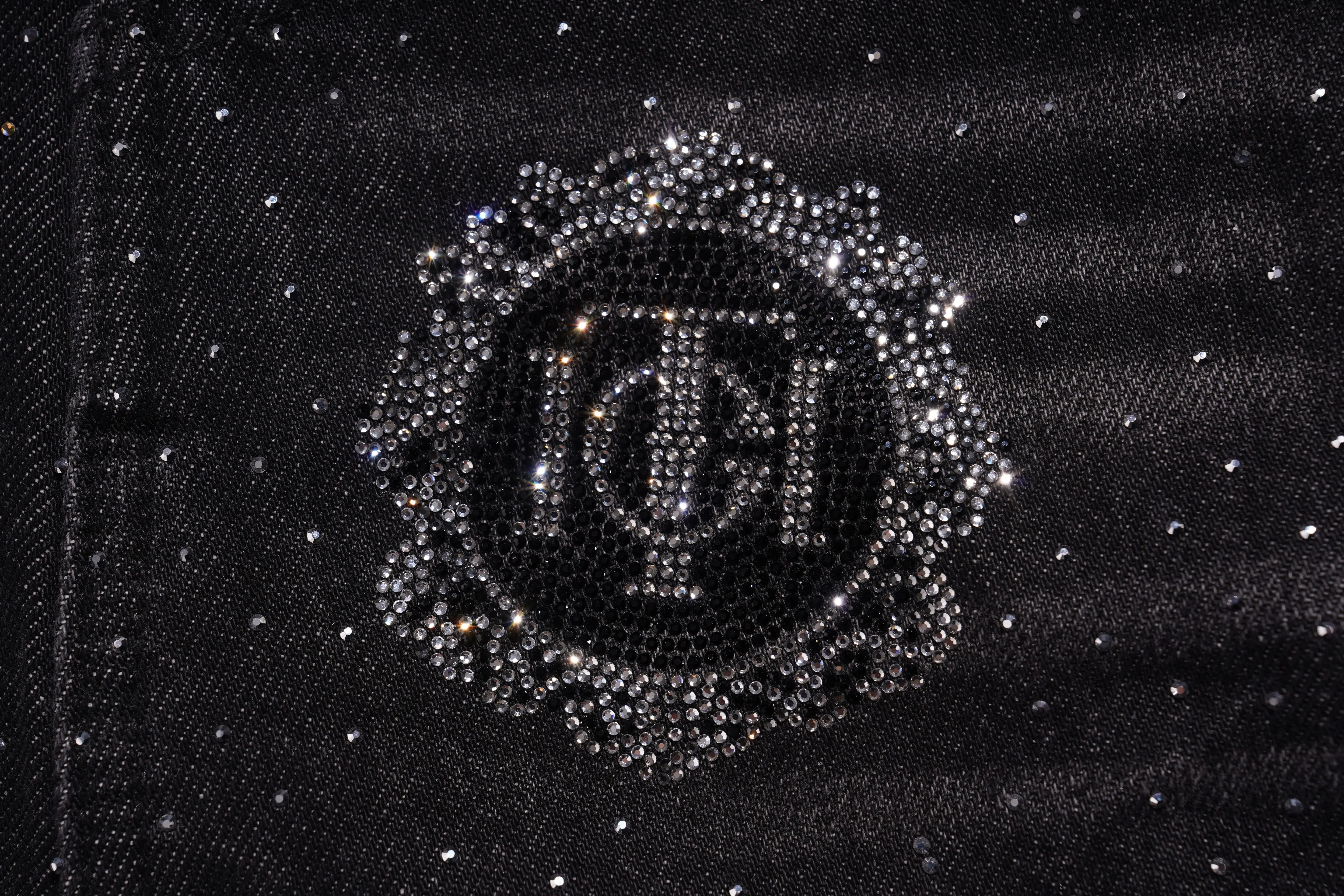 Monogrammed design with rhinestones on a black fabric background, TCH Starry Rhinestone Logo Black Denim Jeans