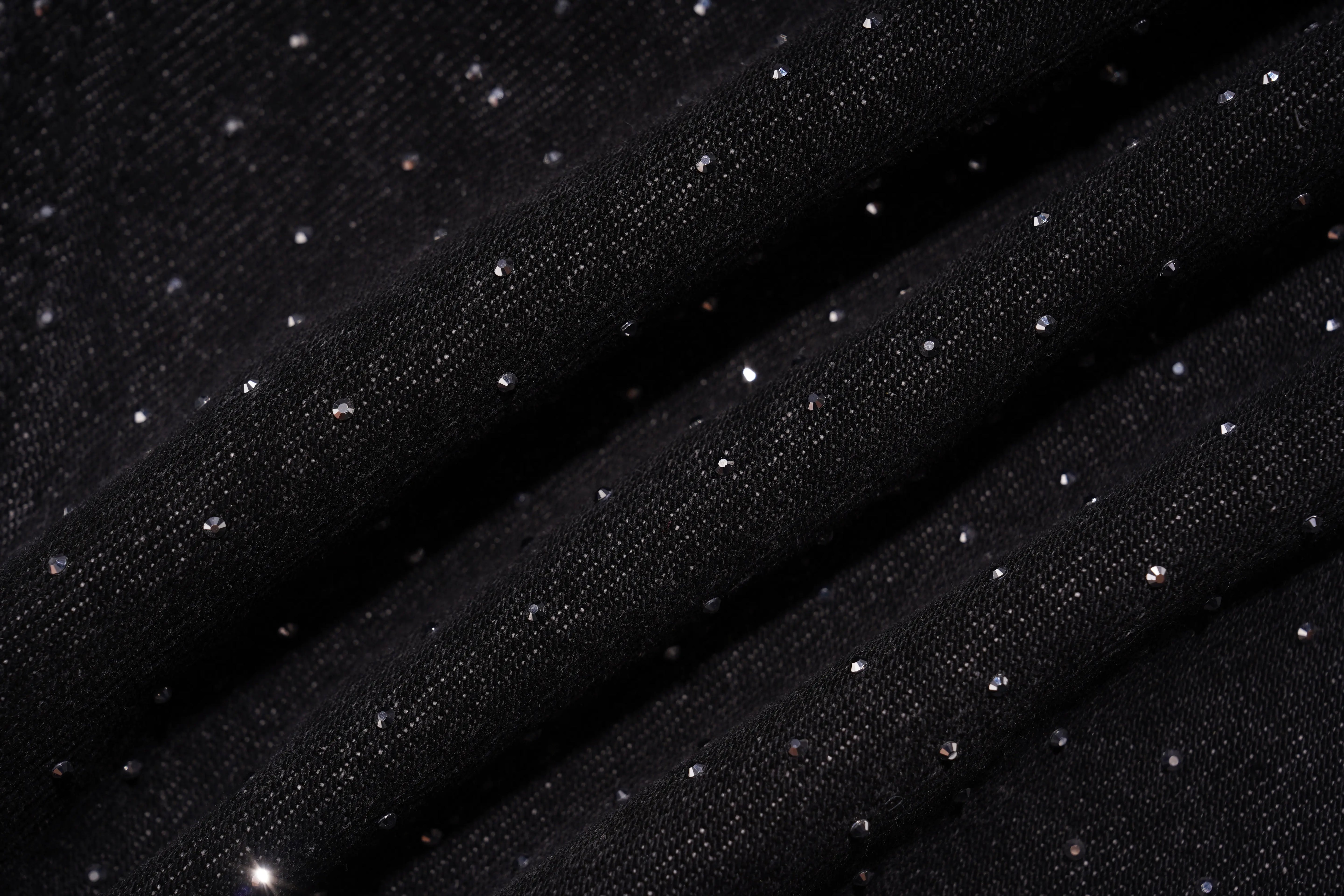 Black fabric with small white dots on a dark background, TCH Starry Rhinestone Logo Black Denim Jeans