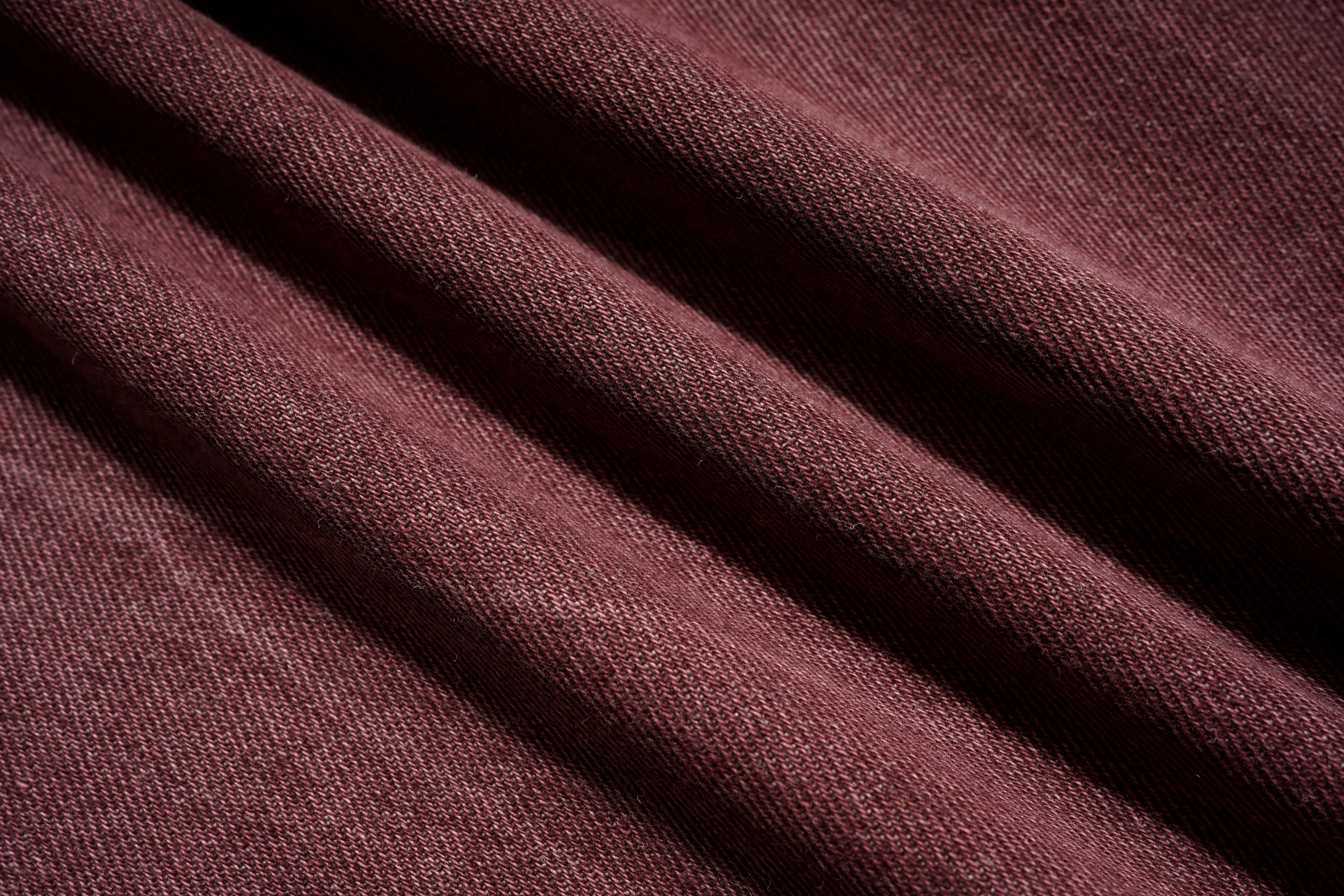 Close-up of maroon fabric with visible texture, TCH Techno Butterfly Rhinestone Burgundy Jeans