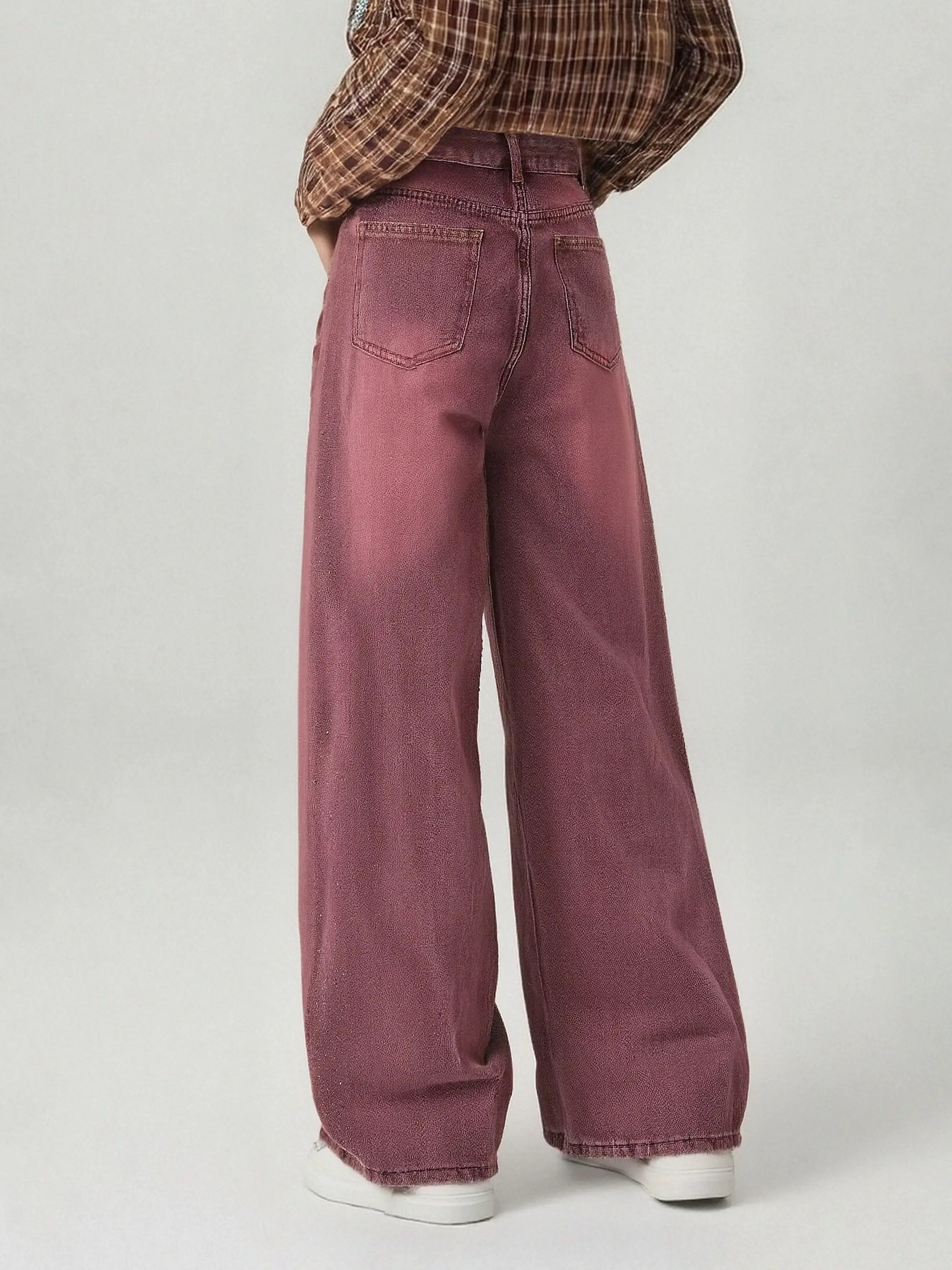 Person wearing maroon wide-leg jeans and a plaid shirt on a white background, TCH Techno Butterfly Rhinestone Burgundy Jeans