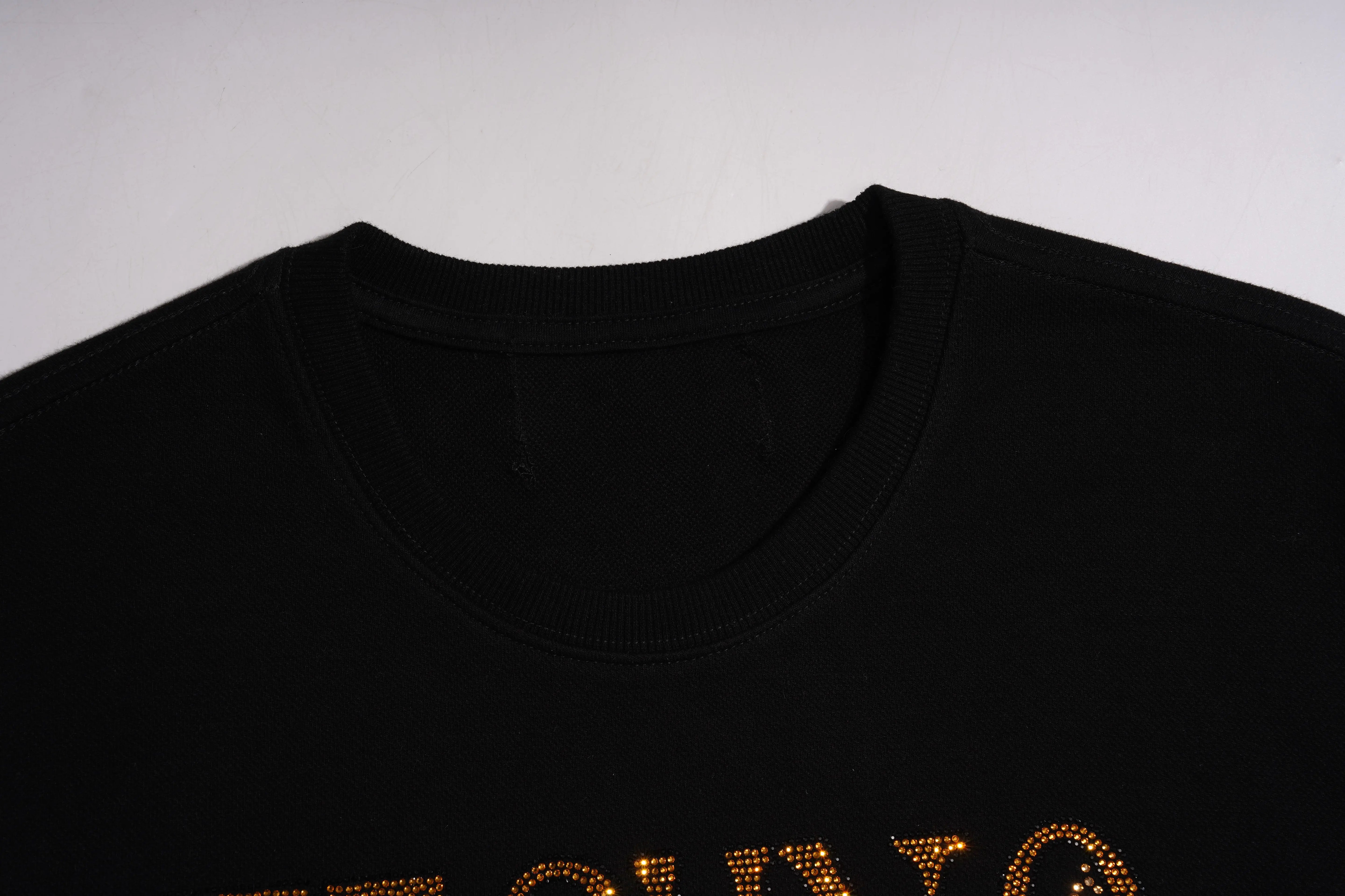 Black t-shirt with gold text on a white background, TCH Techno Rhinestone Graphic Oversize T-Shirt