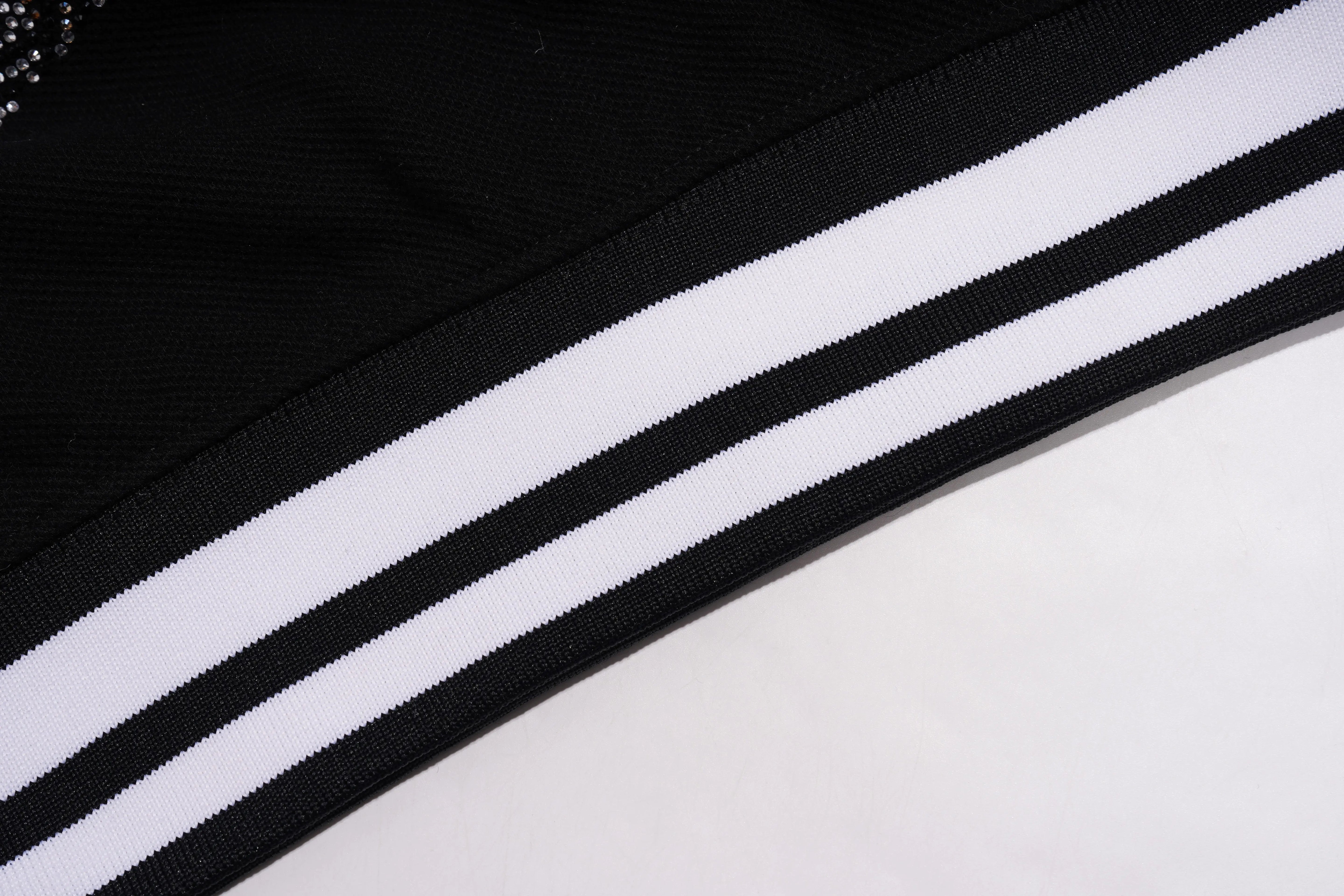 Close-up of a black and white striped fabric on a white background, TCH Techno Teddy Rhinestone T-Shirt