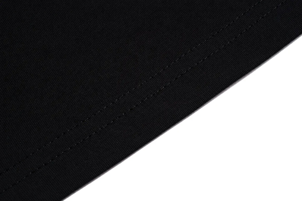 Black and white fabric swatch TCH Teddy Bear Charm Tie Graphic Black Long Sleeve T-Shirt