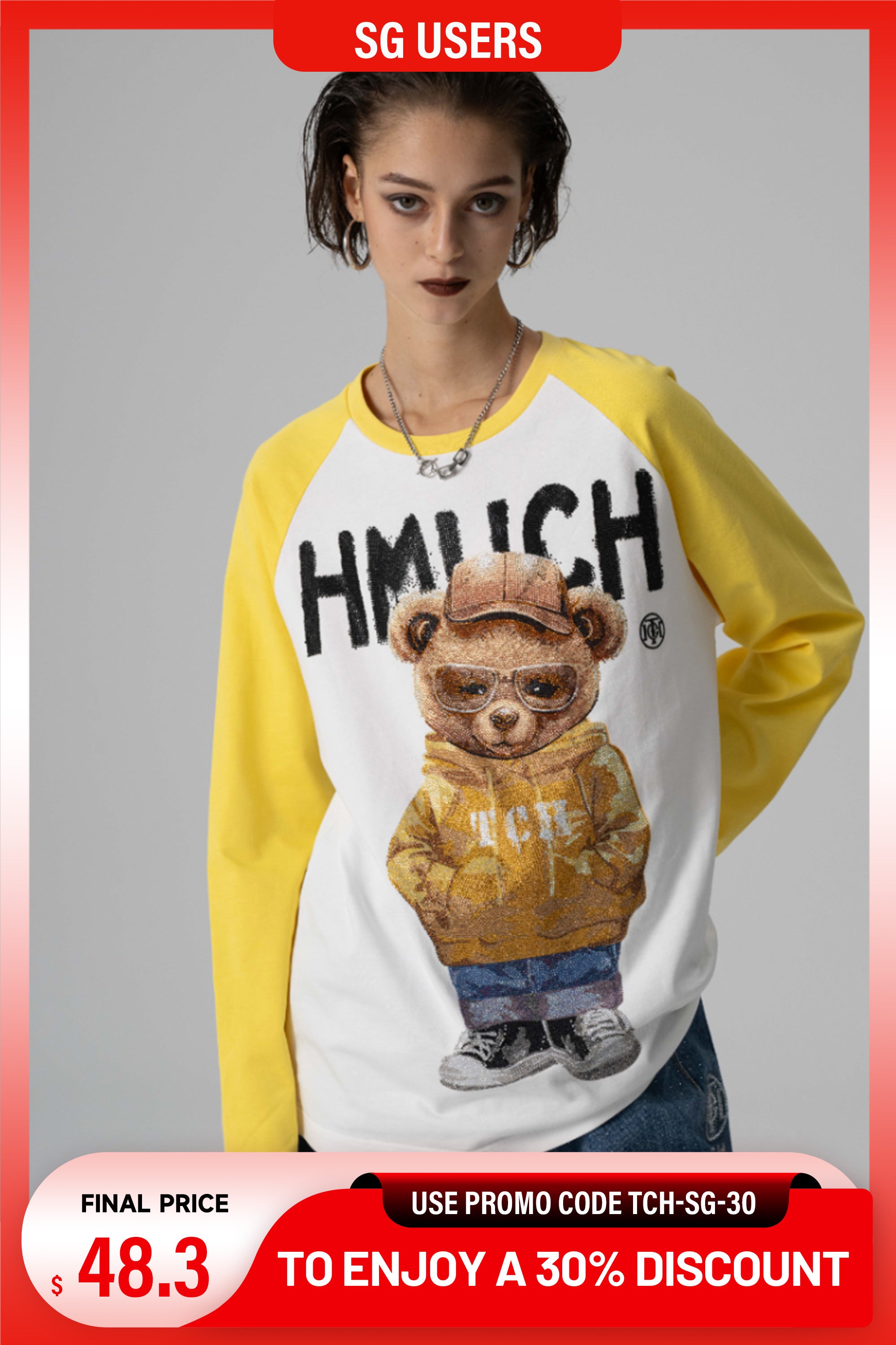 Woman wearing a yellow and white sweatshirt with a bear graphic and text, on a gray background. TCH Teddy Bear Rhinestone Raglan Blouse Top