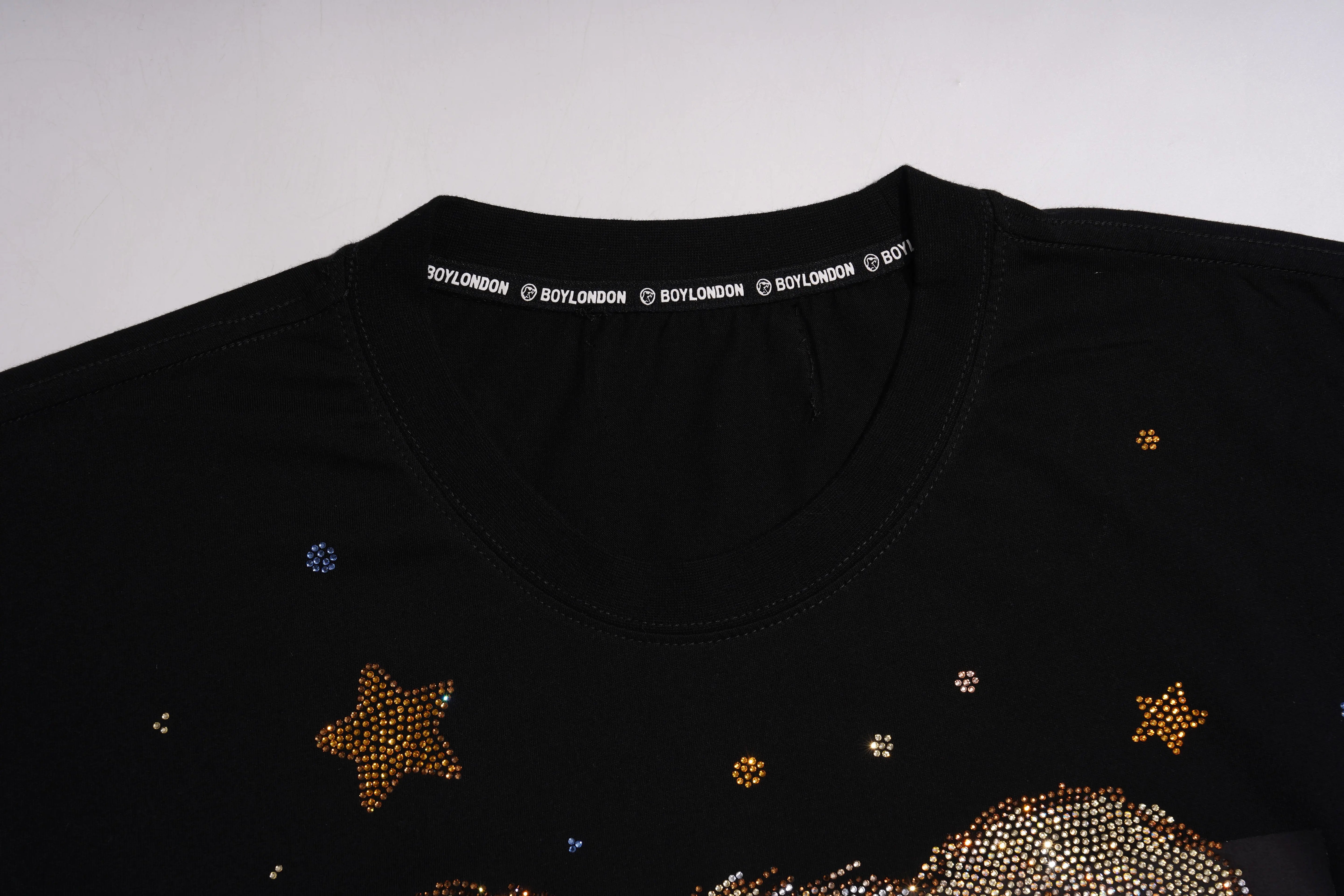 Black shirt with star and moon designs and 'ROYALONDON' branding on a white background, TCH Teddy Bear & Stars Rhinestone T-Shirt