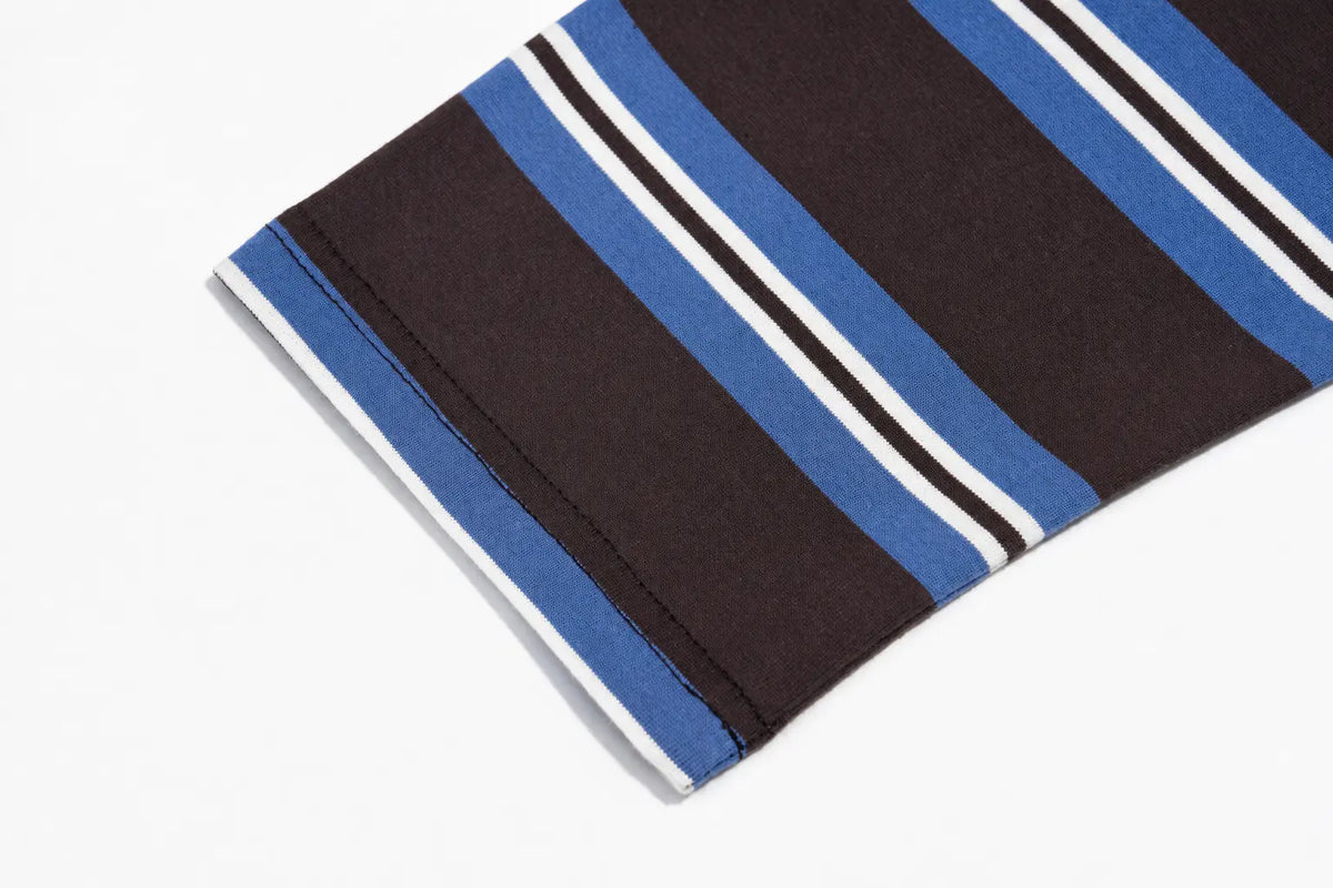 A close-up of a striped fabric product, likely a sleeve or cuff, featuring a dark brown base with alternating blue, white, and thin black stripes. TCH Women's Striped Polo Mini Dress