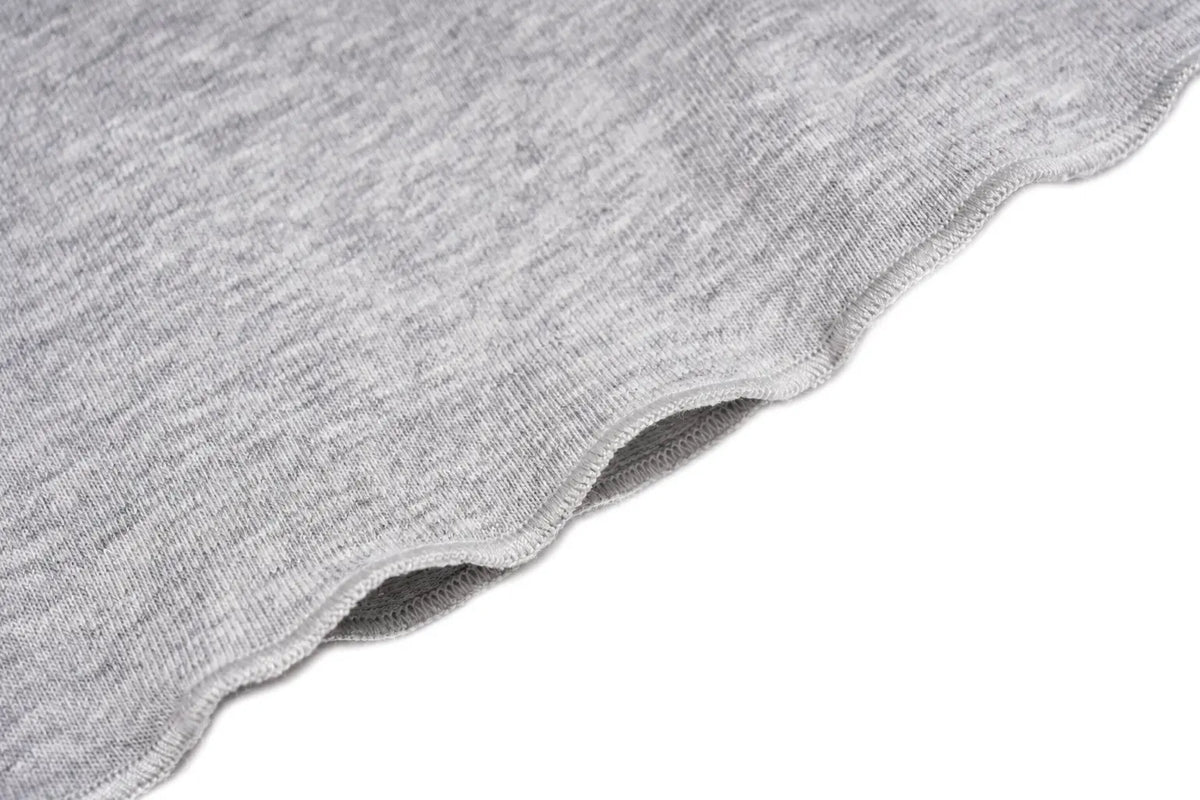 Close-up of a light gray heathered knit fabric with a scalloped edge, shown against a plain white background. TCH Women's Striped Polo Mini Dress