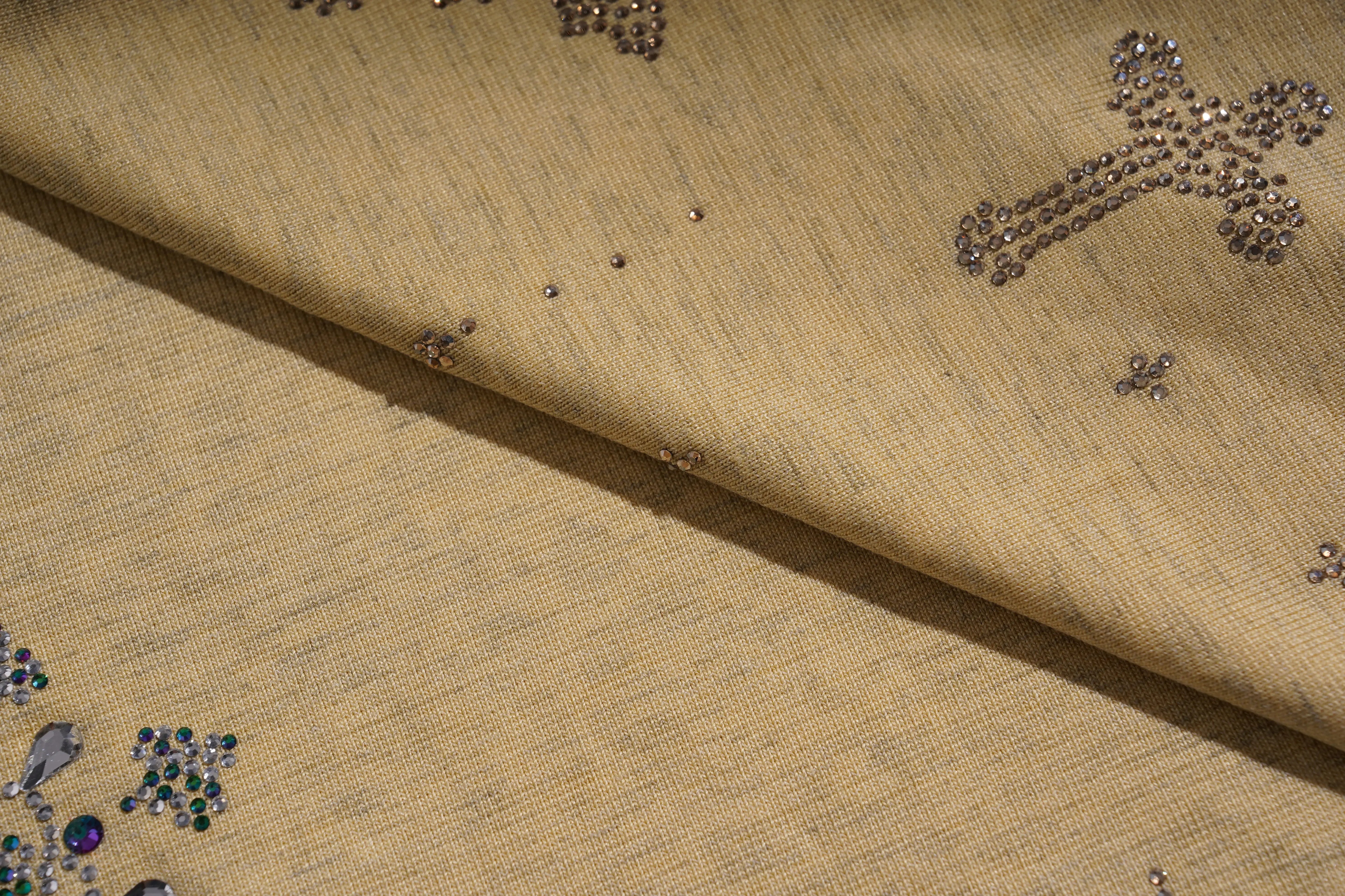 Beige fabric with decorative elements on a beige background, TCH Yellow Butterfly Pajama Set