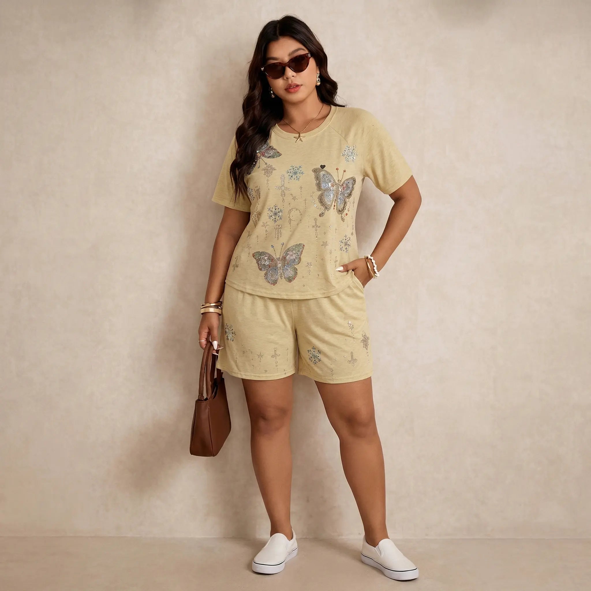 Woman wearing a light yellow outfit with butterfly patterns against a beige background, TCH Yellow Butterfly Pajama Set