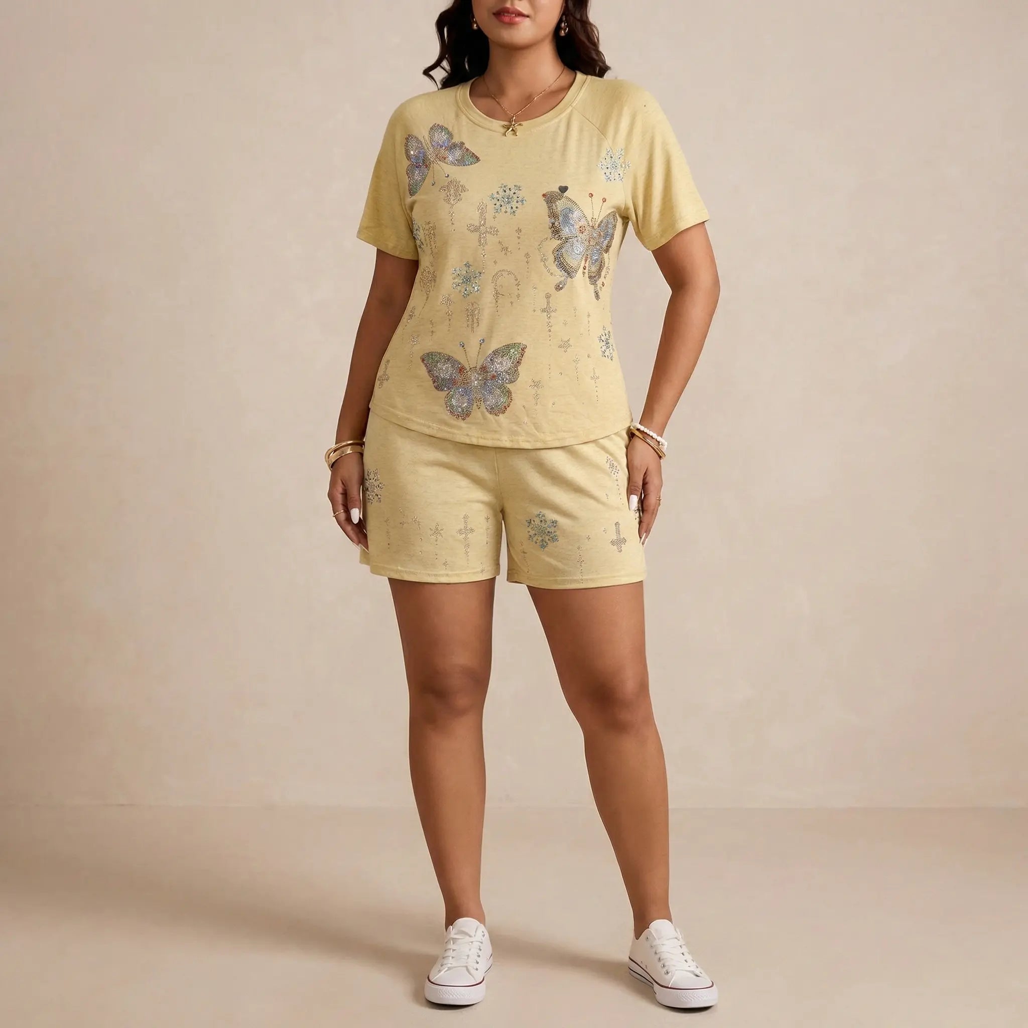 Woman wearing a yellow outfit with butterfly patterns on a beige background, TCH Yellow Butterfly Pajama Set
