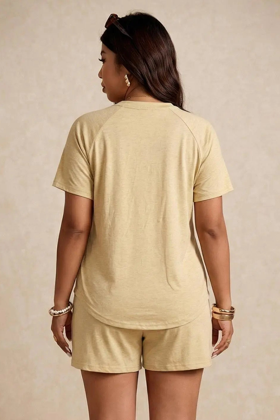Woman wearing a beige t-shirt and shorts set on a beige background, TCH Yellow Butterfly Pajama Set