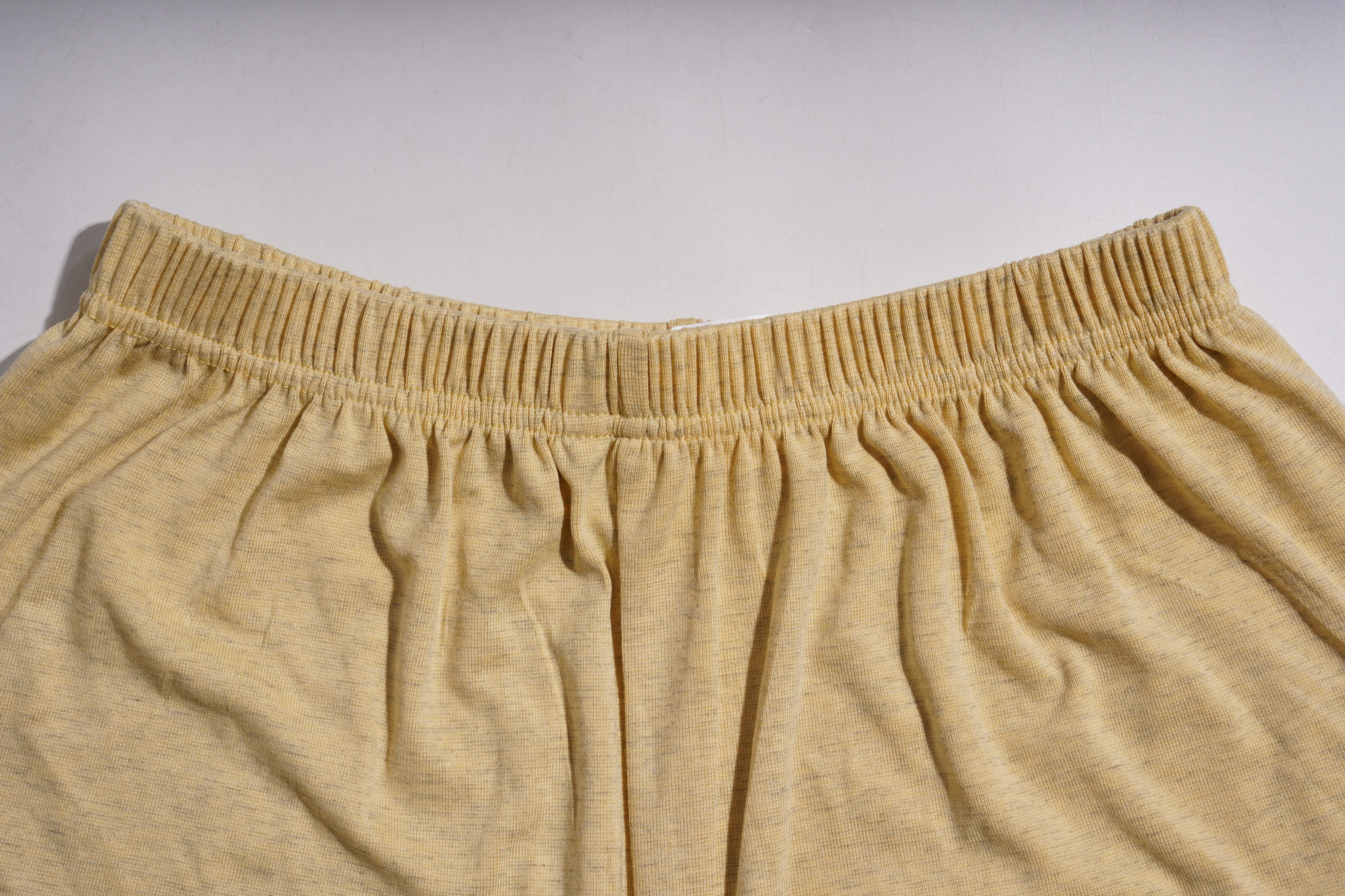 Close-up of beige shorts with a plain background, TCH Yellow Butterfly Pajama Set